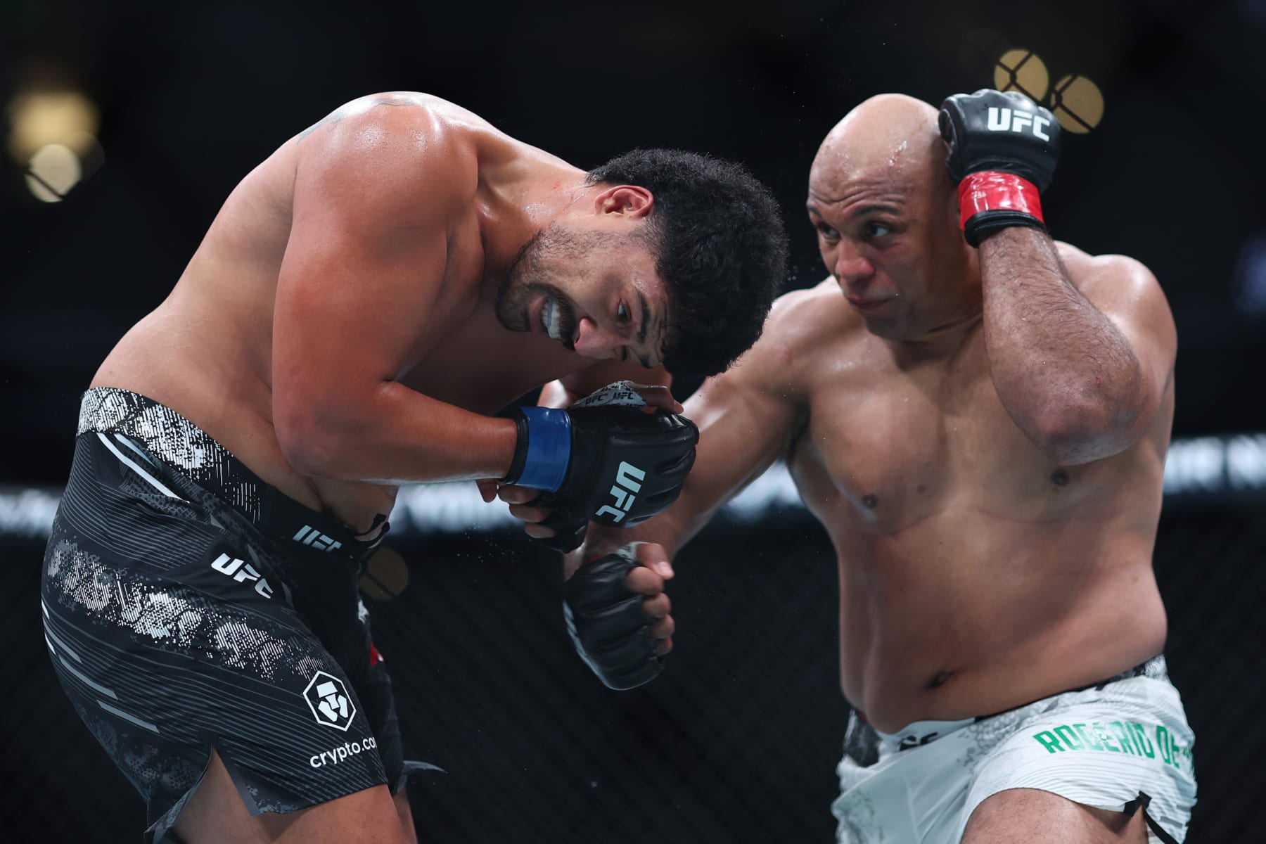 ANAHEIM, CALIFORNIA - FEBRUARY 17: Marcos Rogerio de Lima exchanges strikes with Junior Tafa in their heavyweight fight
during UFC 298 at Honda Center on February 17, 2024 in Anaheim, California. (Photo by Sean M. Haffey/Getty Images)