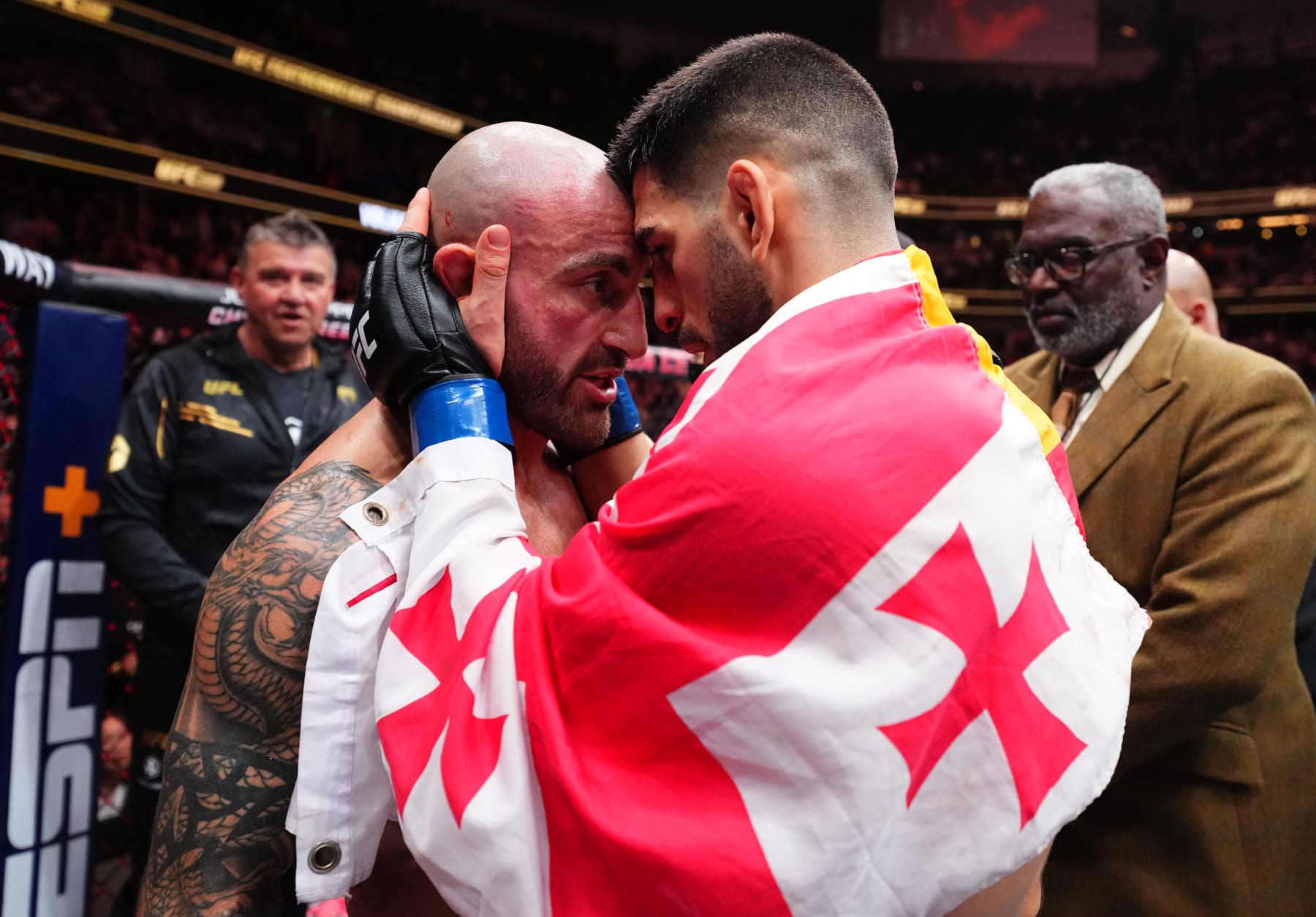 ANAHEIM, CALIFORNIA - FEBRUARY 17: (R-L) Ilia Topuria of Germany and Alexander Volkanovski of Australia talk after their UFC featherweight championship fight during the UFC 298 event at Honda Center on February 17, 2024 in Anaheim, California. (Photo by Chris Unger/Zuffa LLC via Getty Images)