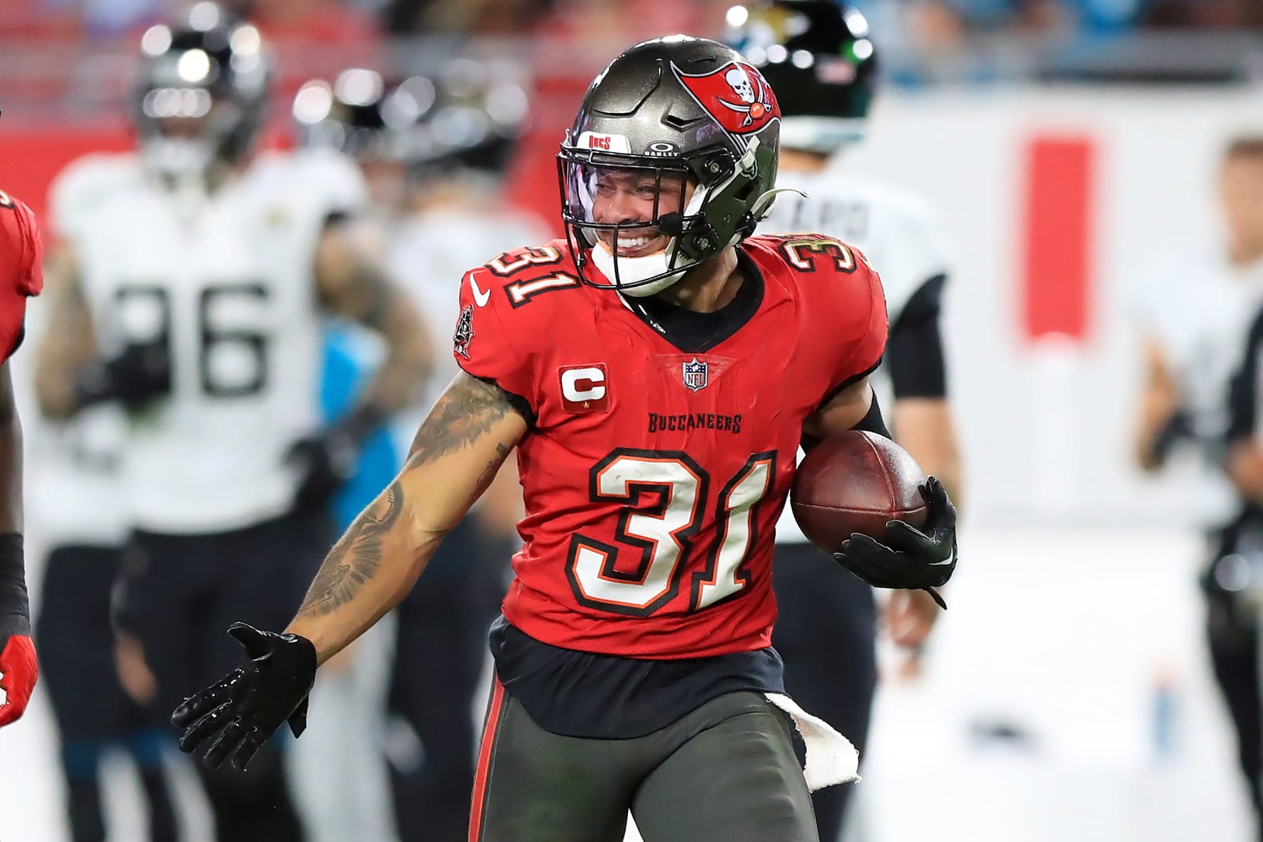 TAMPA, FL - DECEMBER 24: Tampa Bay Buccaneers Safety Antoine Winfield Jr. (31) celebrates a defensive takeaway during the regular season game between the Jacksonville Jaguars and the Tampa Bay Buccaneers on December 24, 2023 at Raymond James Stadium in Tampa, Florida. (Photo by Cliff Welch/Icon Sportswire via Getty Images)