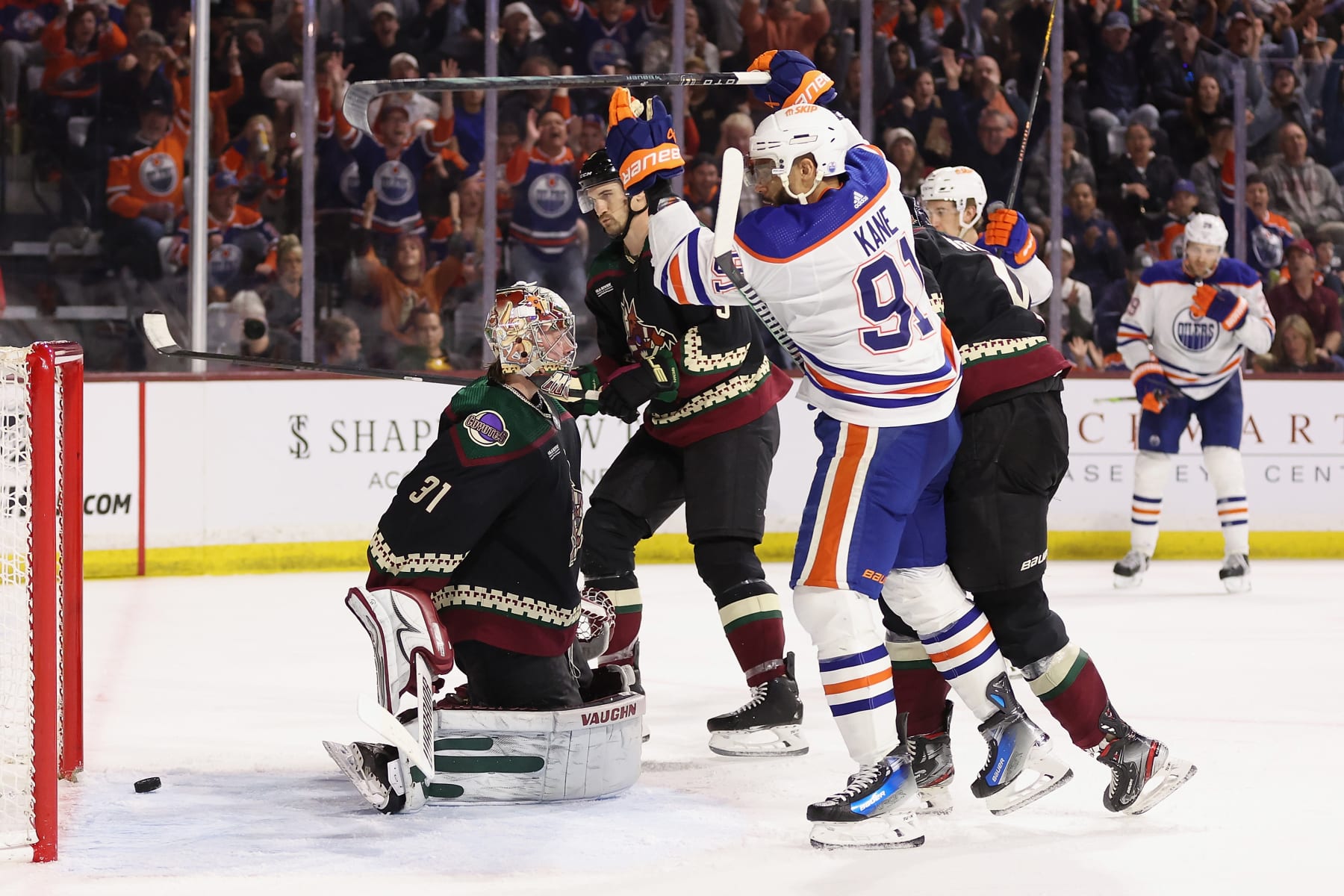 TEMPE, ARIZONA - FEBRUARY 19: Evander Kane #91 of the Edmonton Oilers scores a goal past goaltender Matt Villalta #31 of the Arizona Coyotes during the third period of the NHL game at Mullett Arena on February 19, 2024 in Tempe, Arizona. The Oilers defeated the Coyotes 6-3. (Photo by Christian Petersen/Getty Images)