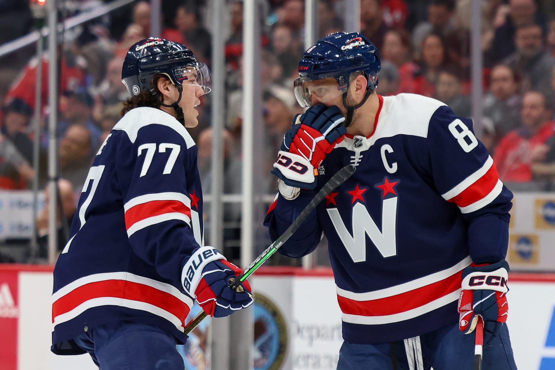 WASHINGTON, DC - FEBRUARY 20: Alex Ovechkin #8 and T.J. Oshie #77 of the Washington Capitals go over a face-off plan during a game against the New Jersey Devils at Capital One Arena on February 20, 2024 in Washington, D.C. (Photo by John McCreary/NHLI via Getty Images)