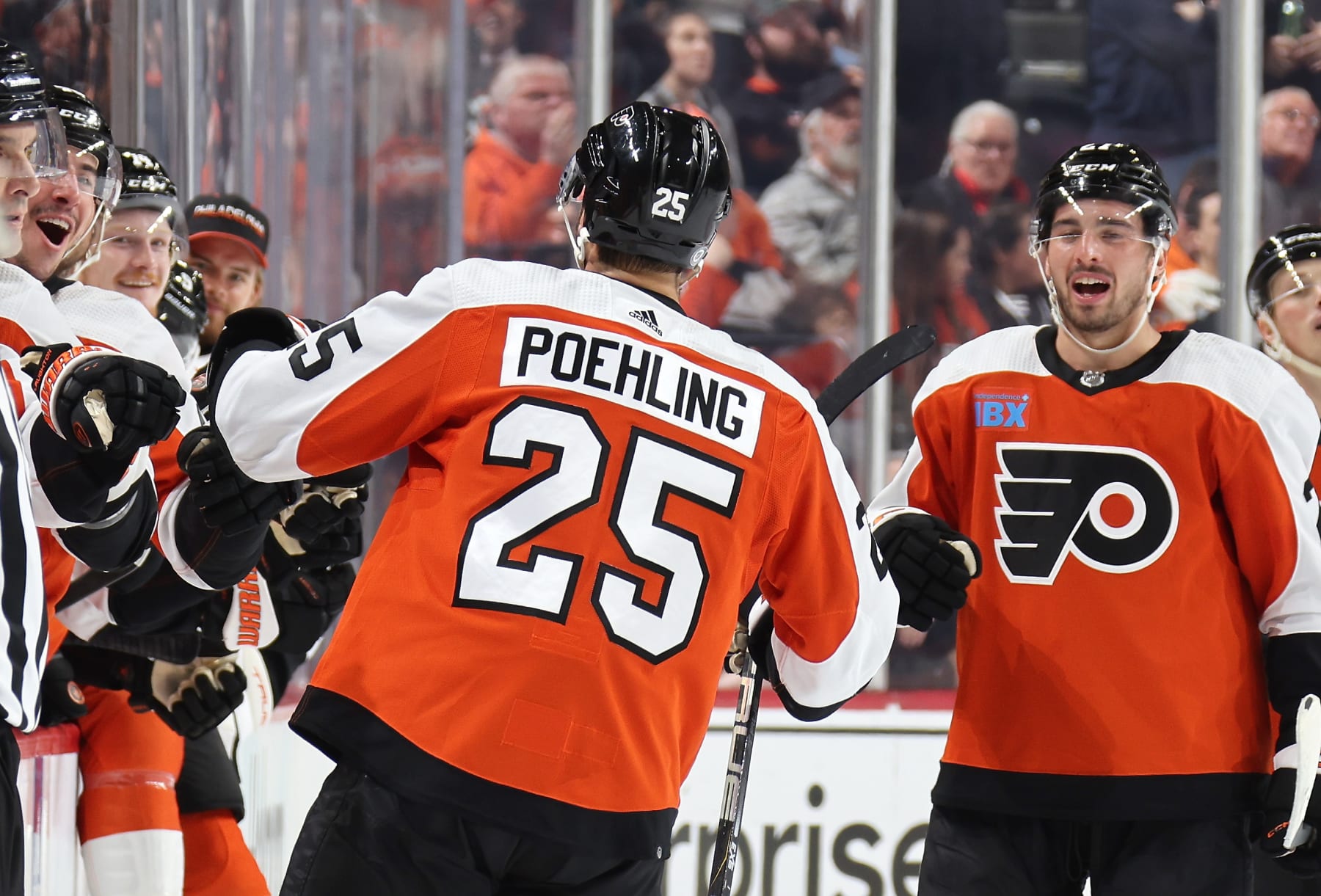 PHILADELPHIA, PENNSYLVANIA - FEBRUARY 10: Ryan Poehling #25 of the Philadelphia Flyers celebrates his first period shorthanded goal with teammates on the bench against the Seattle Kraken at the Wells Fargo Center on February 10, 2024 in Philadelphia, Pennsylvania. (Photo by Len Redkoles/NHLI via Getty Images)