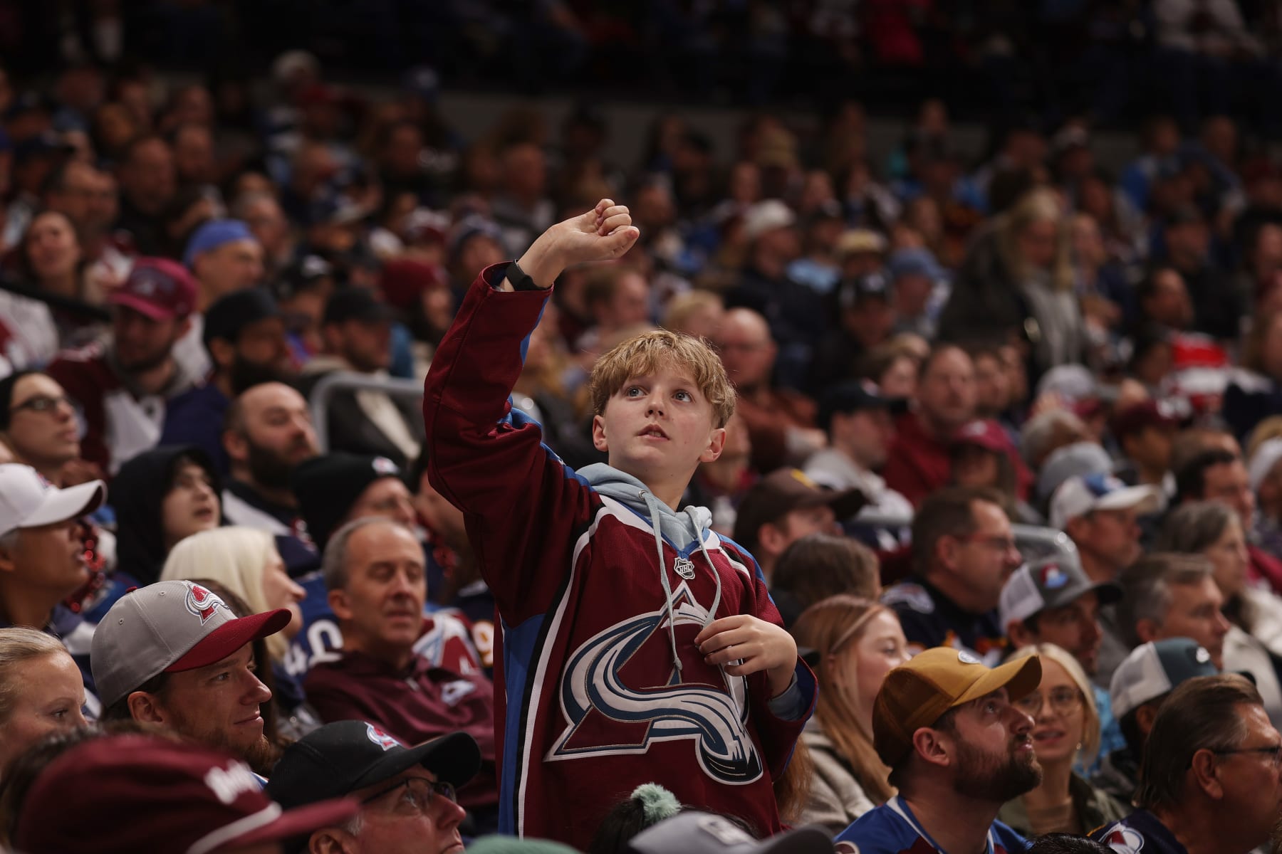 DENVER, COLORADO - FEBRUARY 20: A young of the Colorado Avalanche cheers against the Vancouver Canucks at Ball Arena on February 20, 2024 in Denver, Colorado. (Photo by Michael Martin/NHLI via Getty Images)
