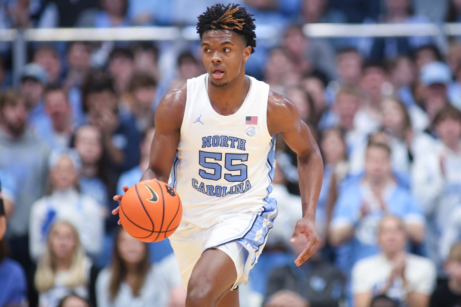 CHAPEL HILL, NC - FEBRUARY 17: North Carolina Tar Heels forward Harrison Ingram (55) brings the ball up court during the college basketball game between the North Carolina Tar Heels and the Virginia Tech Hokies on February 17, 2024 at the Dean Smith Center in Chapel Hill, NC. (Photo by Nicholas Faulkner/Icon Sportswire via Getty Images)