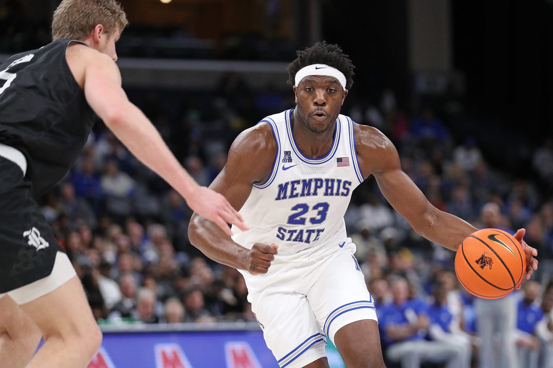 MEMPHIS, TENNESSEE - JANUARY 31: Malcolm Dandridge #23 of the Memphis Tigers drives to the basket against Cameron Sheffield #5 of the Rice Owls during the first half at FedExForum on January 31, 2024 in Memphis, Tennessee. (Photo by Justin Ford/Getty Images)