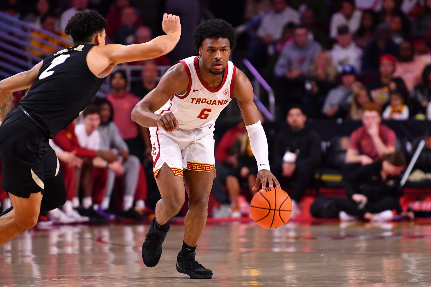 LOS ANGELES, CA - FEBRUARY 17: USC Trojans guard Bronny James (6) dribbles up the court during the college basketball game between the Colorado Buffaloes and the USC Trojans on February 17, 2024 at Galen Center in Los Angeles, CA. (Photo by Brian Rothmuller/Icon Sportswire via Getty Images)