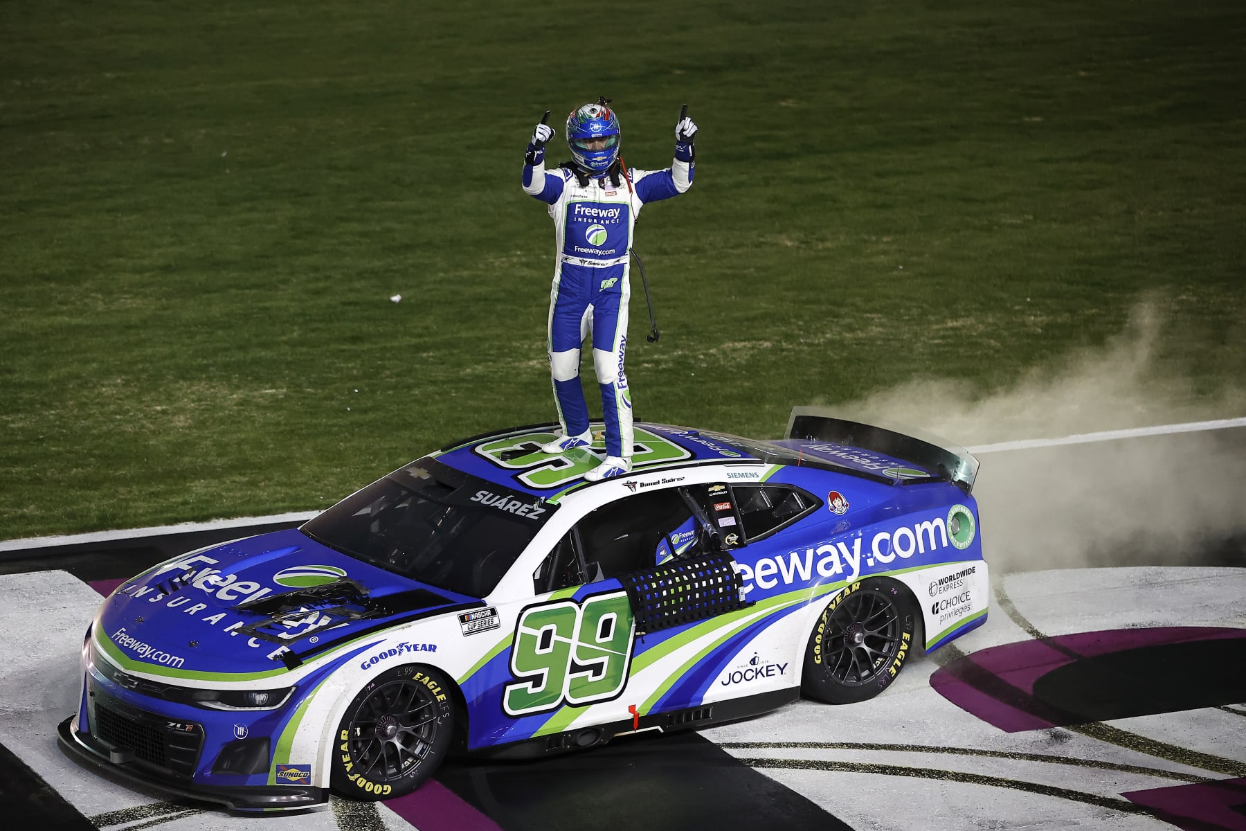 HAMPTON, GEORGIA - FEBRUARY 25: Daniel Suarez, driver of the #99 Freeway Insurance Chevrolet, celebrates after winning the NASCAR Cup Series Ambetter Health 400 at Atlanta Motor Speedway on February 25, 2024 in Hampton, Georgia. (Photo by Alex Slitz/Getty Images)