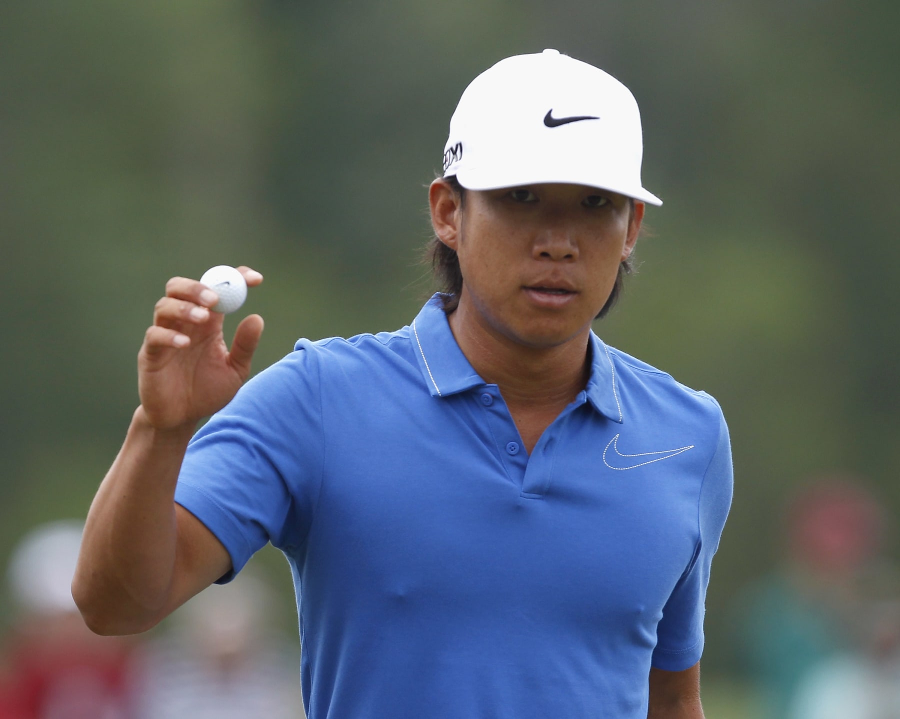 HUMBLE, TX - MARCH 29:  Anthony Kim waves to the gallery after making a par on the second hole during the first round of the Shell Houston Open at Redstone Golf Club tournament course on March 29, 2012 in Humble, Texas.  (Photo by Matt Sullivan/Getty Images)
