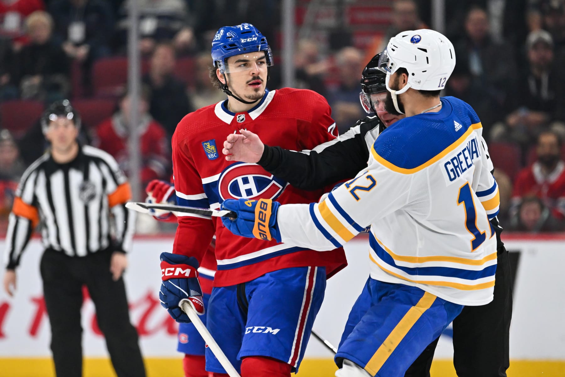 MONTREAL, CANADA - FEBRUARY 21: Arber Xhekaj #72 of the Montreal Canadiens and Jordan Greenway #12 of the Buffalo Sabres stare each other down during the second period at the Bell Centre on February 21, 2024 in Montreal, Quebec, Canada. (Photo by Minas Panagiotakis/Getty Images)