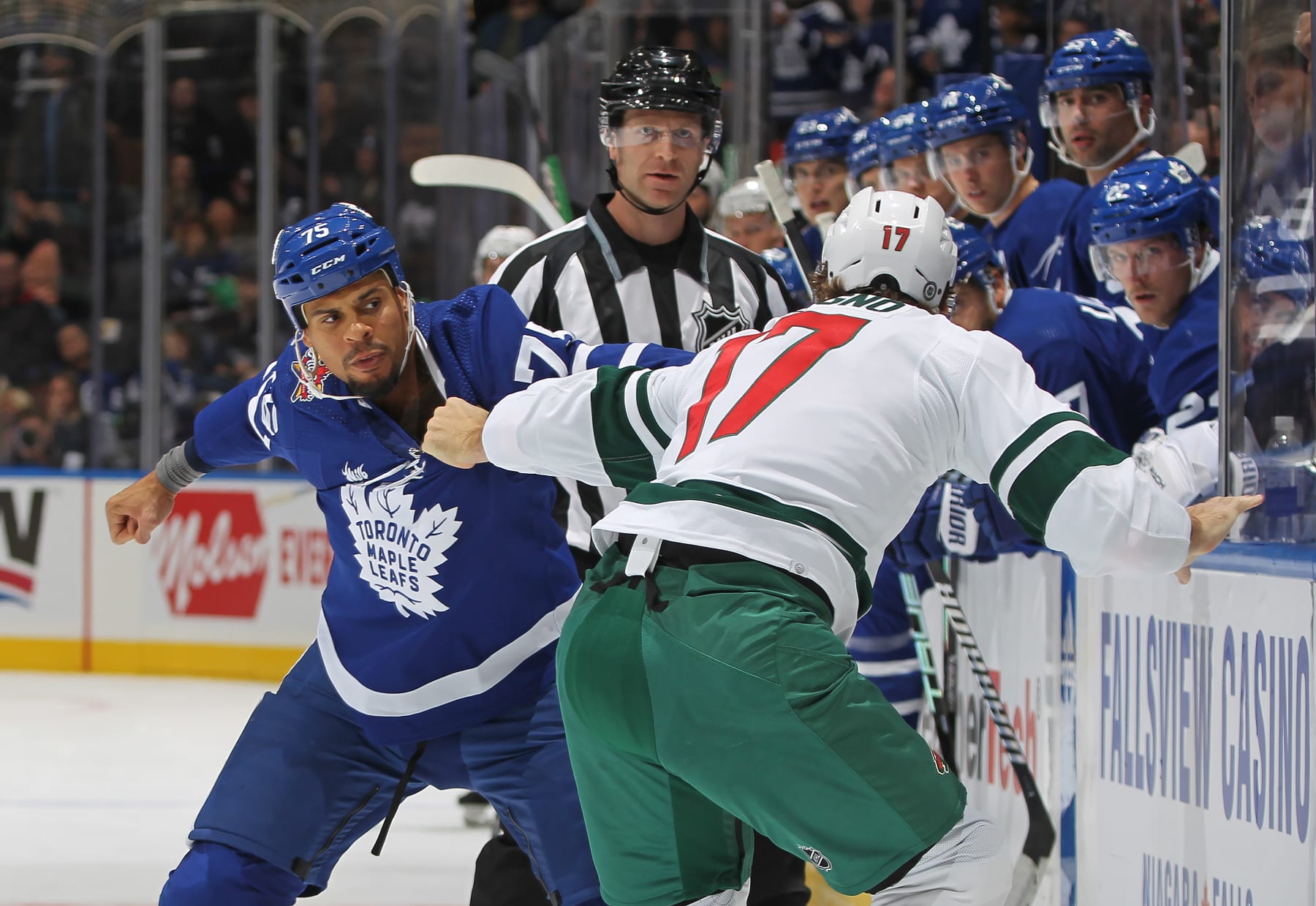 TORONTO, CANADA - OCTOBER 14: Marcus Foligno #17 of the Minnesota Wild fights against Ryan Reaves #75 of the Toronto Maple Leafs during the first period in an NHL game at Scotiabank Arena on October 14, 2023 in Toronto, Ontario, Canada. (Photo by Claus Andersen/Getty Images)