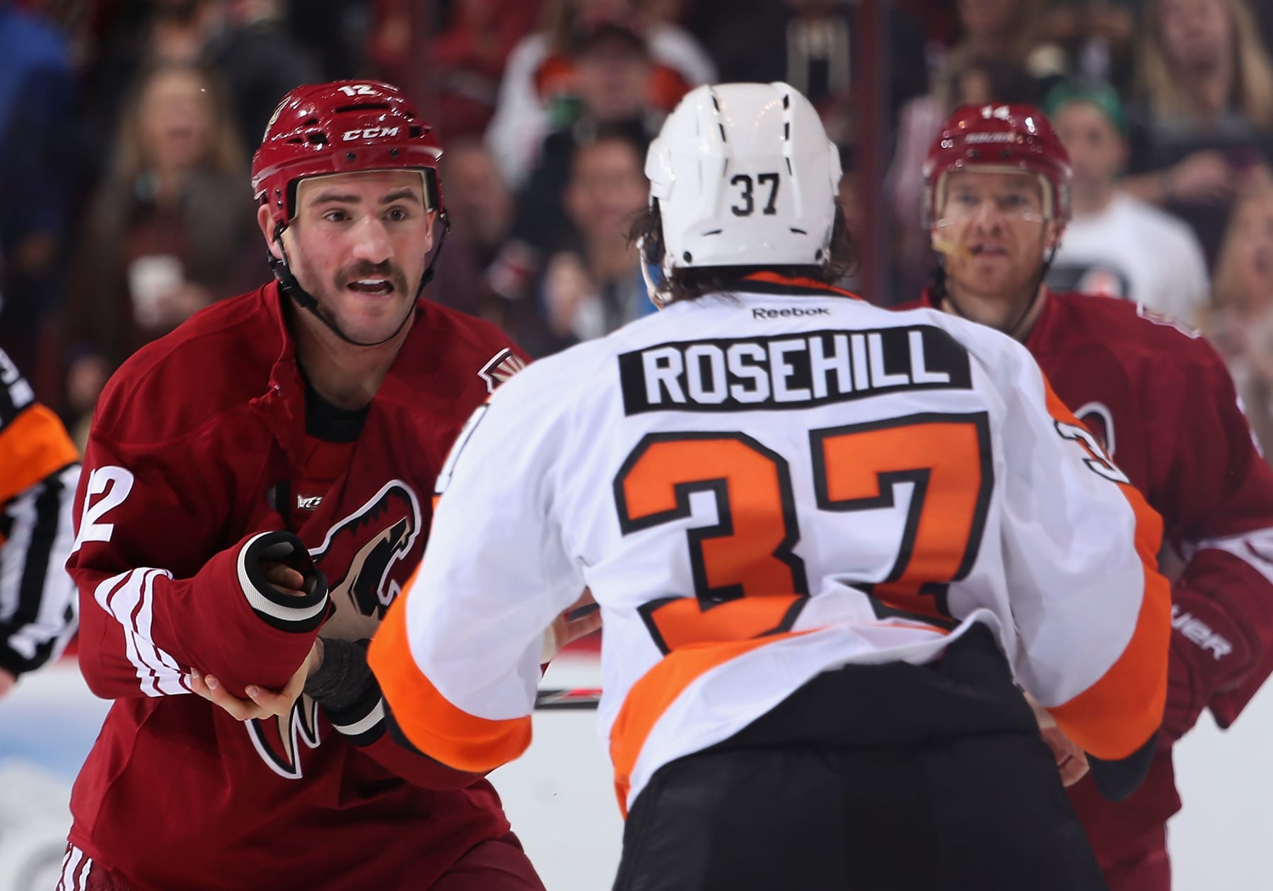GLENDALE, AZ - JANUARY 04: Paul Bissonnette #12 of the Phoenix Coyotes fights with Jay Rosehill #37 of the Philadelphia Flyers during the second period of the NHL game at Jobing.com Arena on January 4, 2014 in Glendale, Arizona. (Photo by Christian Petersen/Getty Images)