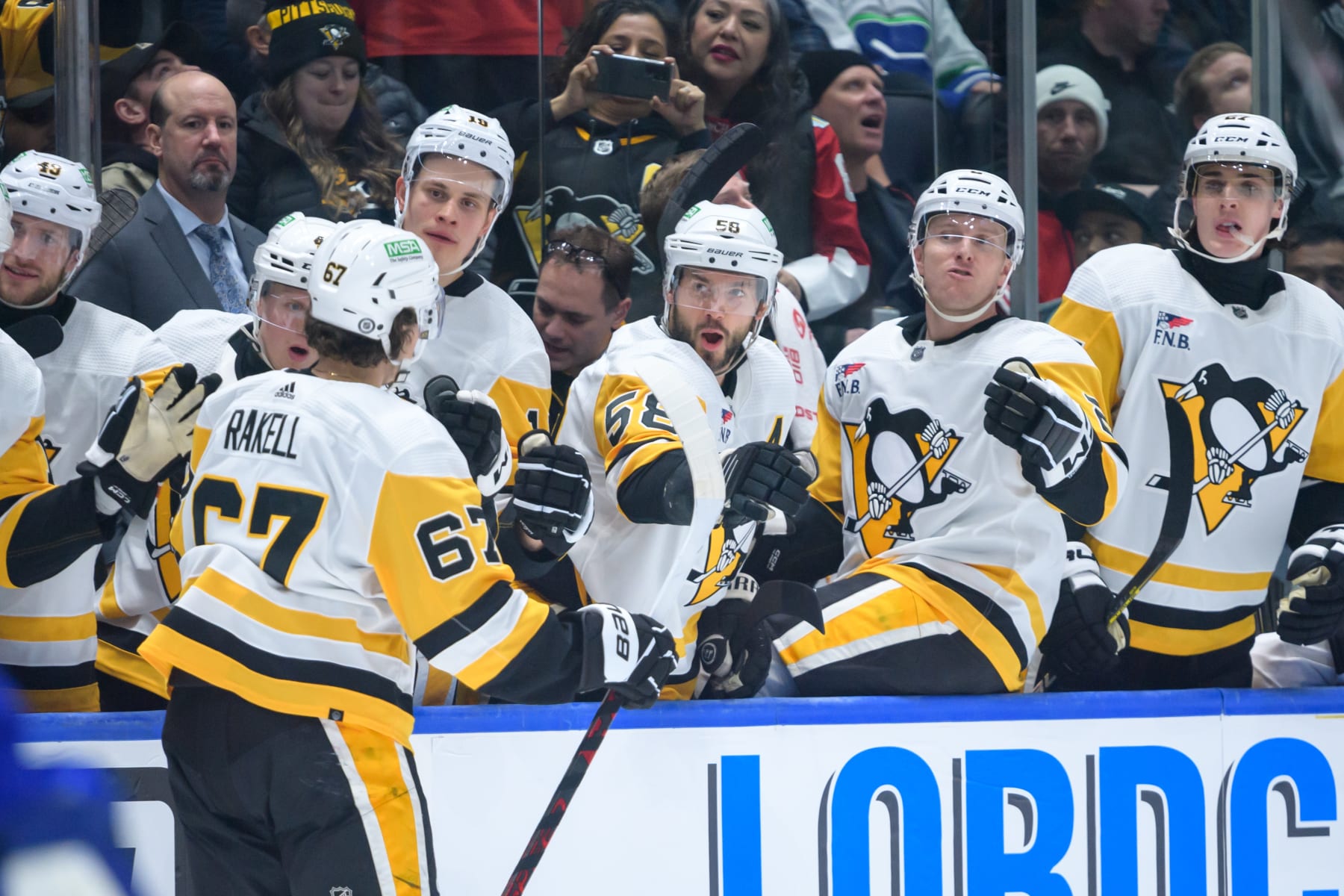 VANCOUVER, CANADA - FEBRUARY 27: Rickard Rakell #67 of the Pittsburgh Penguins celebrates with the bench after scoring a goal against the Vancouver Canucks during the second period at Rogers Arena on February 27, 2024 in Vancouver, British Columbia, Canada. (Photo by Derek Cain/Getty Images)
