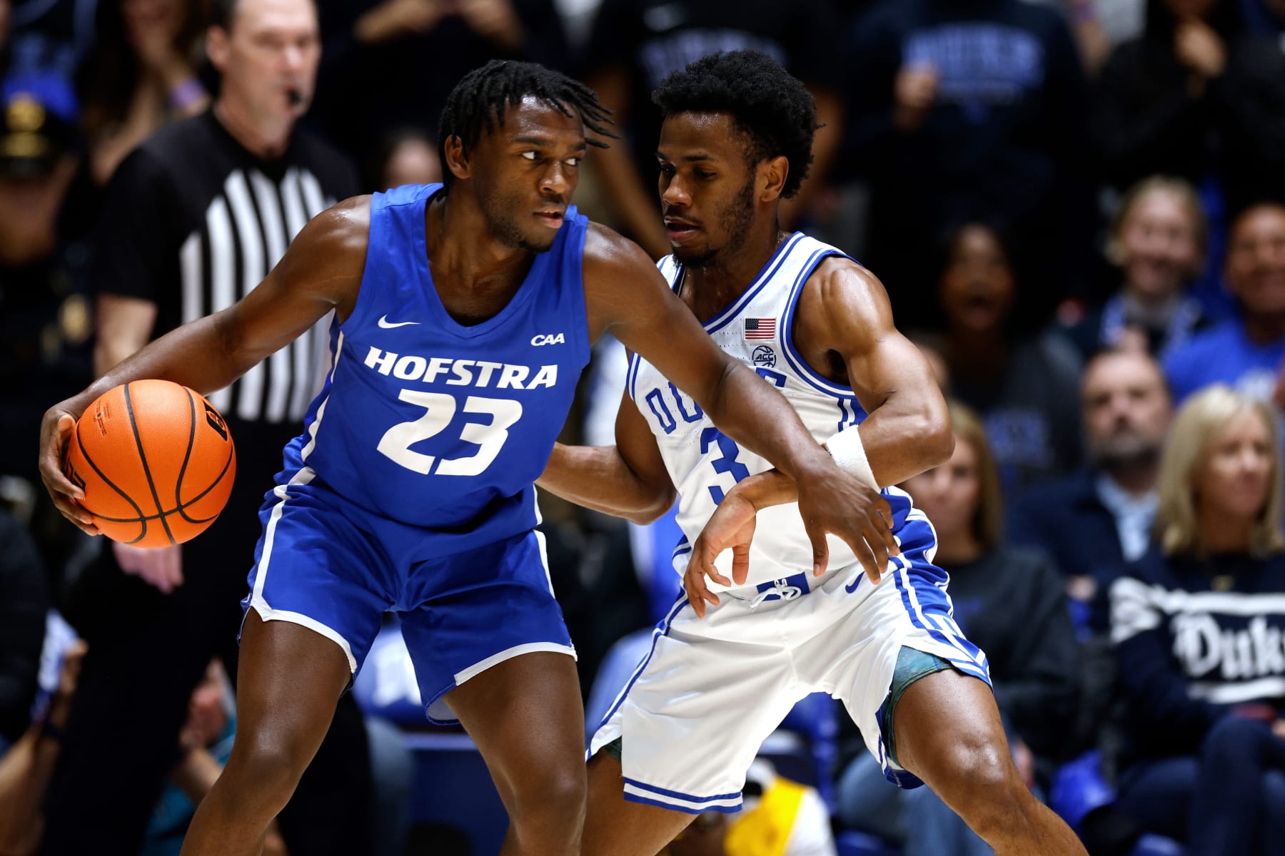 DURHAM, NORTH CAROLINA - DECEMBER 12: Tyler Thomas #23 of the Hofstra Pride moves the ball against Jeremy Roach #3 of the Duke Blue Devils during the first half of the game at Cameron Indoor Stadium on December 12, 2023 in Durham, North Carolina. (Photo by Lance King/Getty Images)