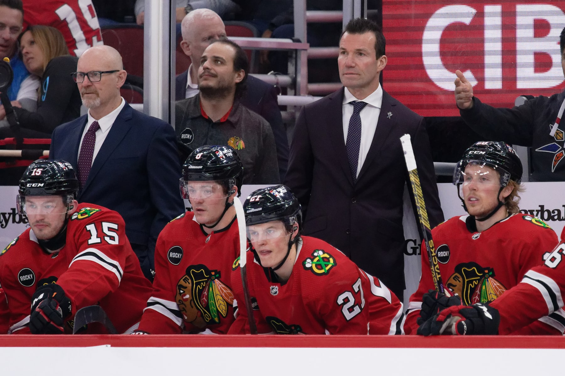 CHICAGO, ILLINOIS - FEBRUARY 09: Assistant Coach Derek King, left, and Head Coach Luke Richardson of the Chicago Blackhawks watch their team play against the New York Rangers on February 09, 2024 at United Center in Chicago, Illinois. (Photo by Jamie Sabau/Getty Images)