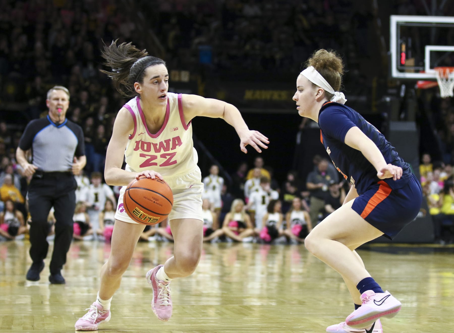IOWA CITY, IOWA- FEBRUARY 25: Guard Caitlin Clark #22 of the Iowa Hawkeyes goes to the basket during the second half against guard Gretchen Dolan #5 of the Illinois Fighting Illini at Carver-Hawkeye Arena on February 25, 2024 in Iowa City, Iowa. (Photo by Matthew Holst/Getty Images)