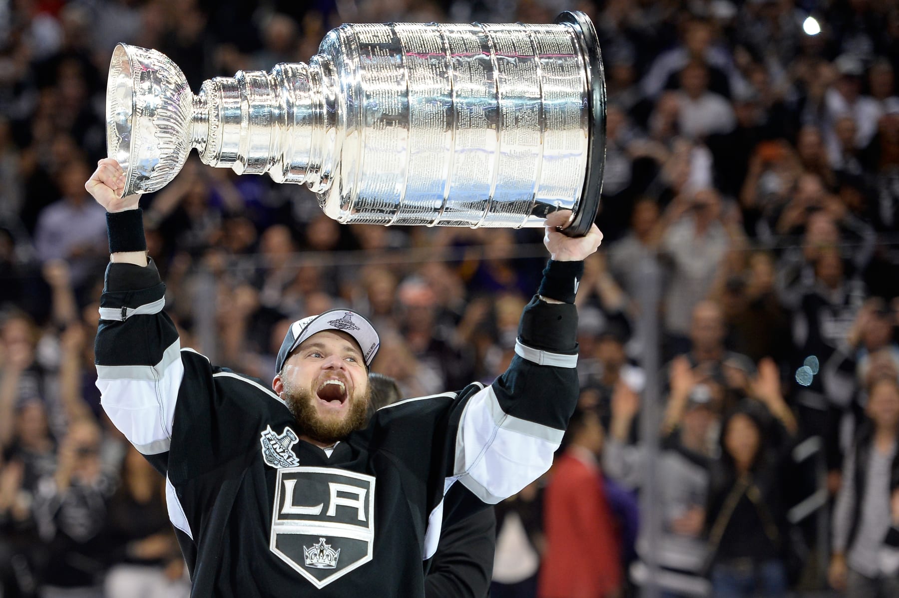LOS ANGELES, CA - JUNE 13: Marian Gaborik #12 of the Los Angeles Kings hoists the Stanley Cup in celebration after defeating the New York Rangers 3-2 in double overtime of Game Five of the 2014 Stanley Cup Final at Staples Center on June 13, 2014 in Los Angeles, California. (Photo by Harry How/Getty Images)