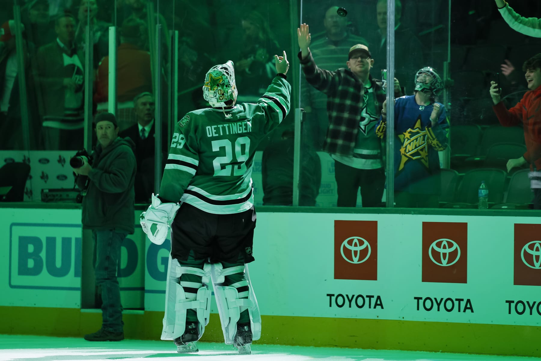 DALLAS, TEXAS - FEBRUARY 29: Jake Oettinger #29 of the Dallas Stars tosses a puck into the stands after the game against the Winnipeg Jets at American Airlines Center on February 29, 2024 in Dallas, Texas. (Photo by Sam Hodde/Getty Images)