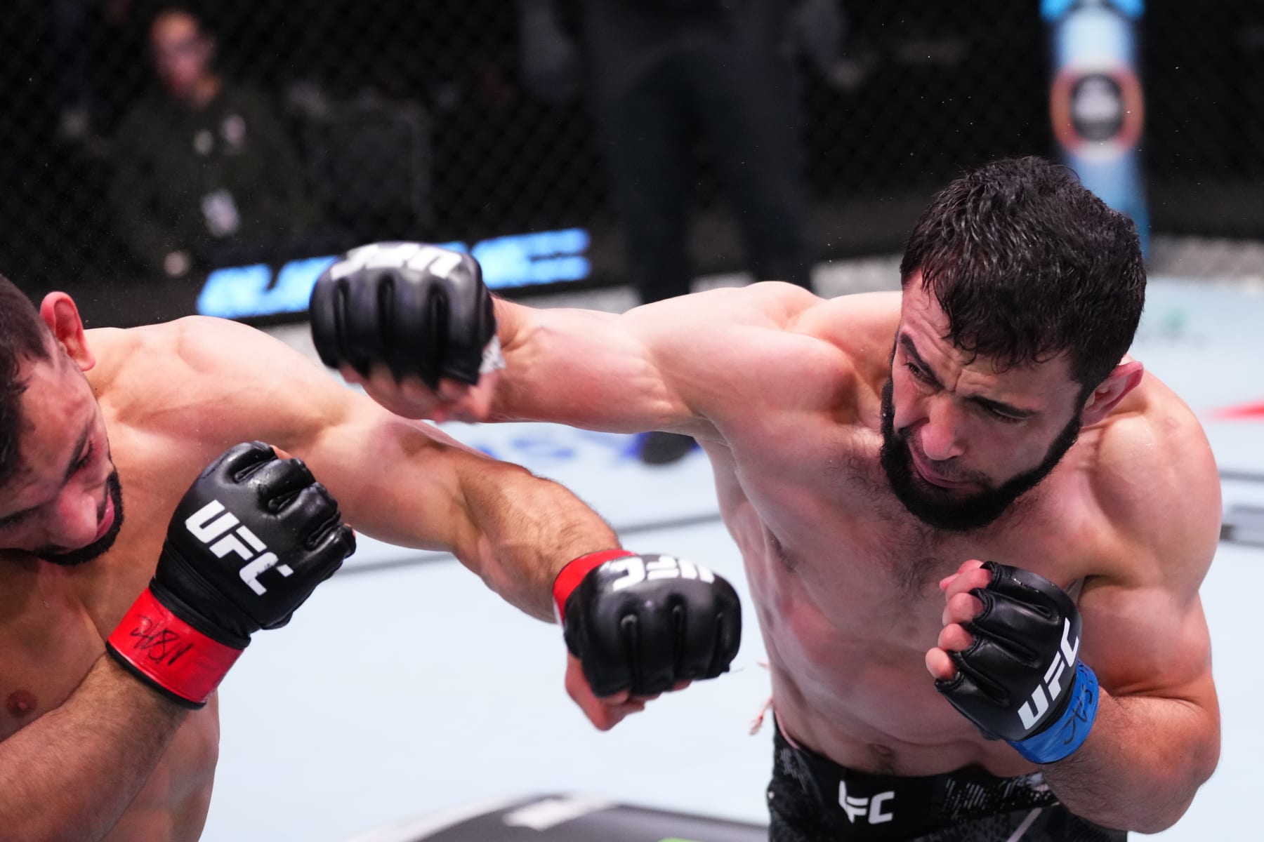 LAS VEGAS, NEVADA - MARCH 02: (R-L) Loik Radzhabov of Tajikistan punches Abdul-Kareem Al-Selwady during the UFC Fight Night event at UFC APEX on March 02, 2024 in Las Vegas, Nevada. (Photo by Jeff Bottari/Zuffa LLC via Getty Images)