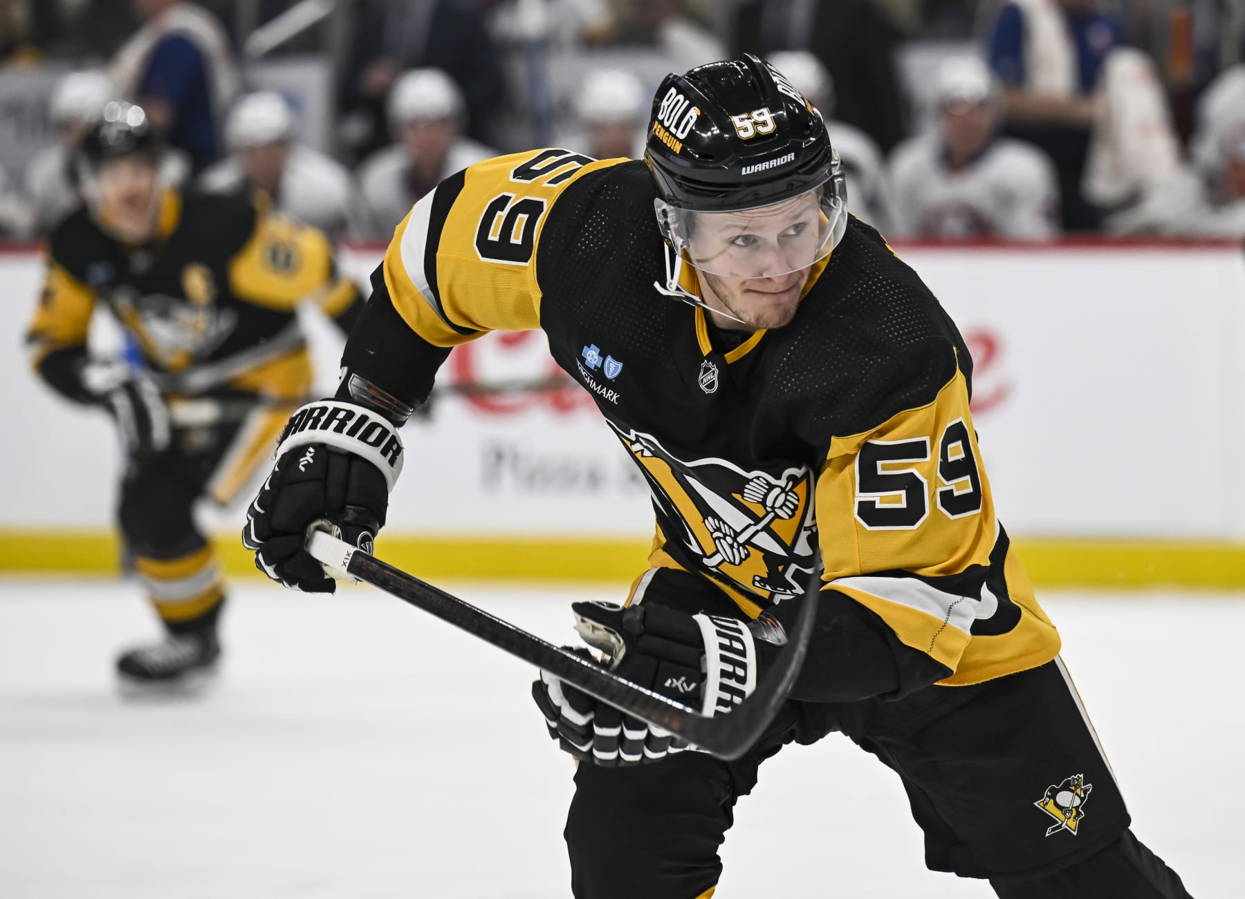 PITTSBURGH, PA - DECEMBER 31: Pittsburgh Penguins left wing Jake Guentzel (59) looks on during the first period in the NHL game between the Pittsburgh Penguins and the New York Islanders on December 31, 2023, at PPG Paints Arena in Pittsburgh, PA. (Photo by Jeanine Leech/Icon Sportswire via Getty Images)