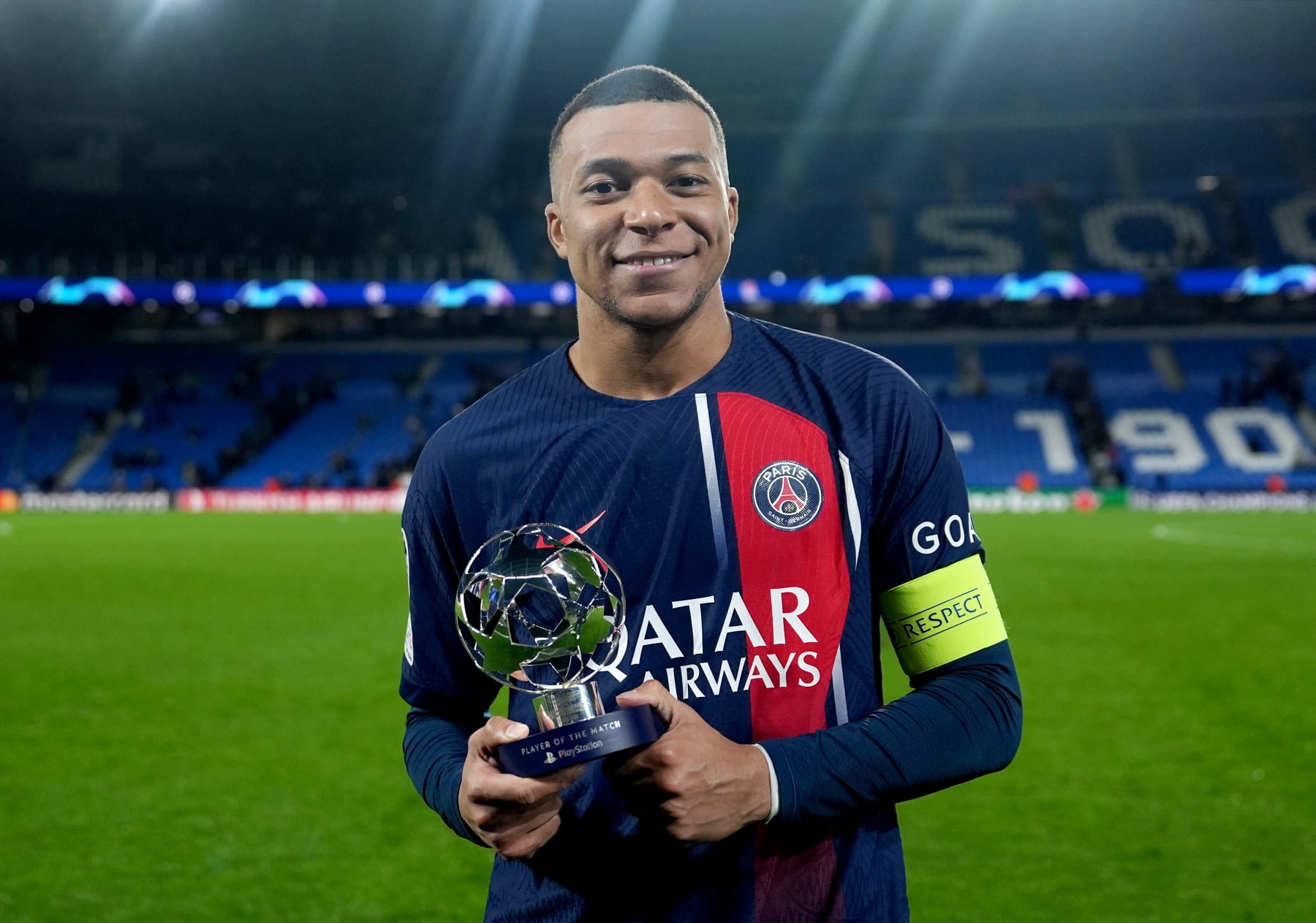 SAN SEBASTIAN, SPAIN - MARCH 05: Kylian Mbappe of Paris Saint-Germain poses for a photo with the PlayStation Player Of The Match award after the team's victory in the UEFA Champions League 2023/24 round of 16 second leg match between Real Sociedad and Paris Saint-Germain at Reale Arena on March 05, 2024 in San Sebastian, Spain. (Photo by Juanma - UEFA/UEFA via Getty Images)