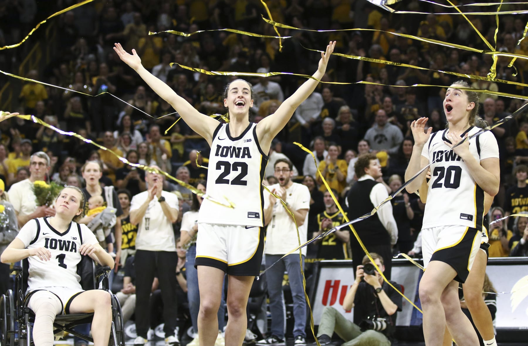 IOWA CITY, IOWA- MARCH 3: Guard Caitlin Clark #22 and guard Kate Martin #20 of the Iowa Hawkeyes celebrates in the confetti after senior day festivities after the match-up against the Ohio State Buckeyes at Carver-Hawkeye Arena on March 3, 2024 in Iowa City, Iowa. (Photo by Matthew Holst/Getty Images)