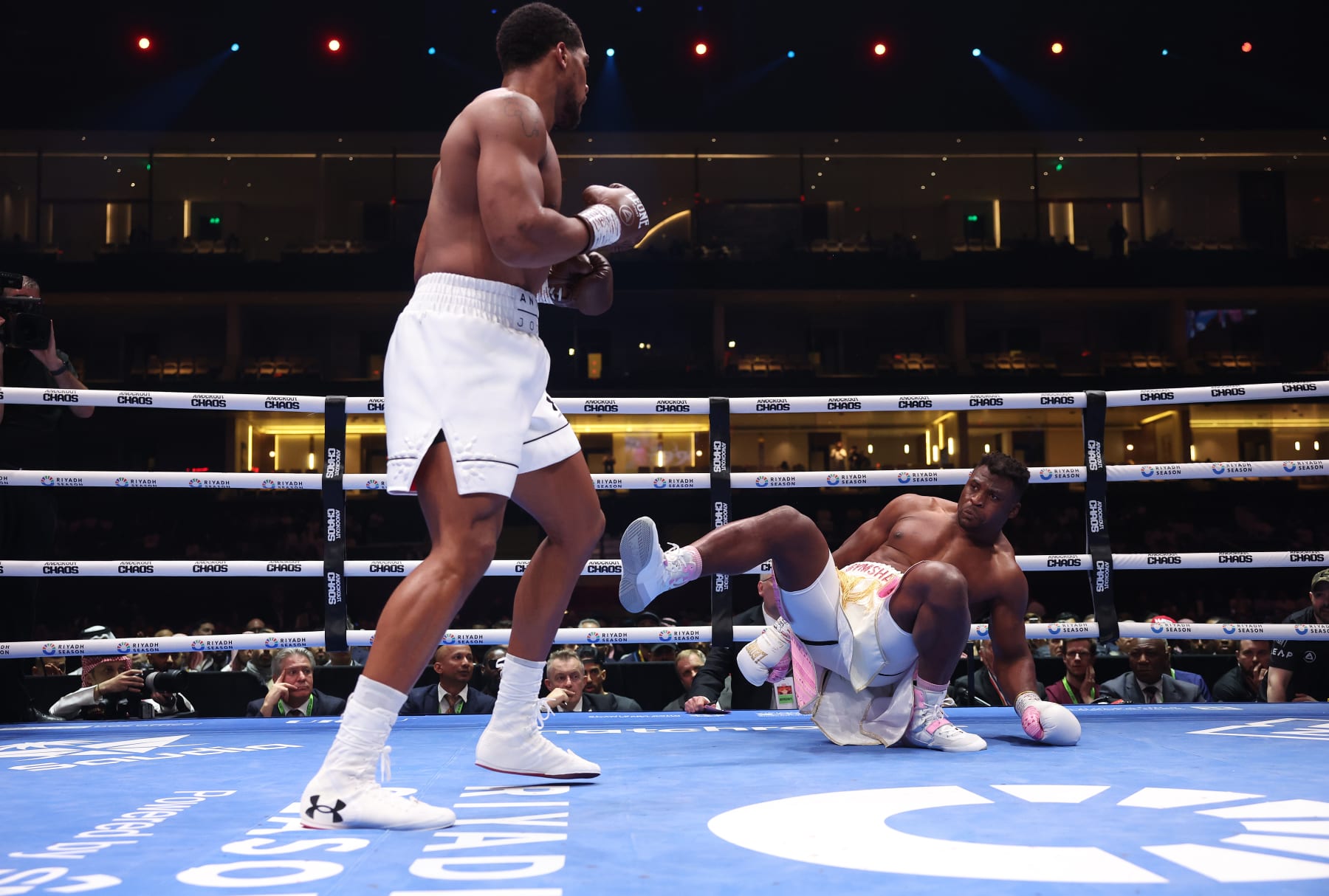 RIYADH, SAUDI ARABIA - MARCH 8: Anthony Joshua knocks down Francis N'Gannou for the 1st time during their Heavyweight Contest at Kingdom Arena on March 8, 2024 in Riyadh, Saudi Arabia. (Photo by Mark Robinson/Matchroom Boxing via Getty Images)