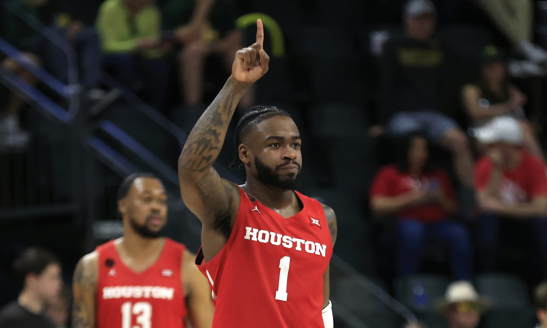 WACO, TX - FEBRUARY 24: Jamal Shead #1 of the Houston Cougars celebrates in the final seconds of the team's victory over the Baylor Bears in over time at Foster Pavilion on February 24, 2024 in Waco, Texas. (Photo by Ron Jenkins/Getty Images)
