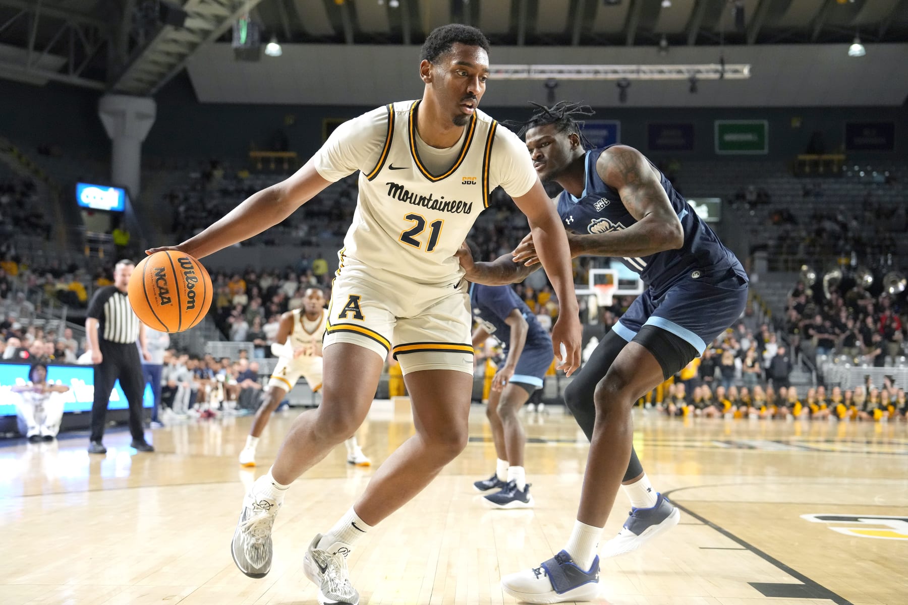 BOONE, NC - FEBRUARY 28: Justin Abson #21 of the Appalachian State Mountaineers dribbles the ball during a college basketball game against the Old Dominion Monarchs at the Holmes Convocation Center on February 28, 2024 in Boone, North Carolina. (Photo by Mitchell Layton/Getty Images)