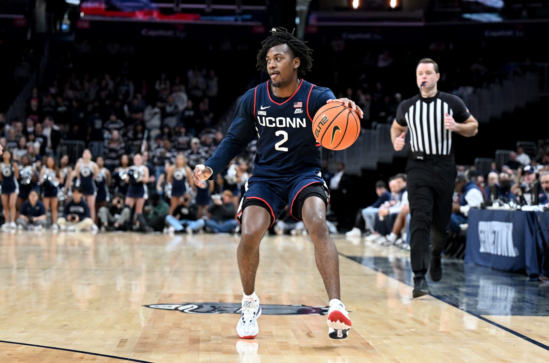 WASHINGTON, DC - FEBRUARY 10: Tristen Newton #2 of the Connecticut Huskies handles the ball against the Georgetown Hoyas at Capital One Arena on February 10, 2024 in Washington, DC. (Photo by G Fiume/Getty Images)