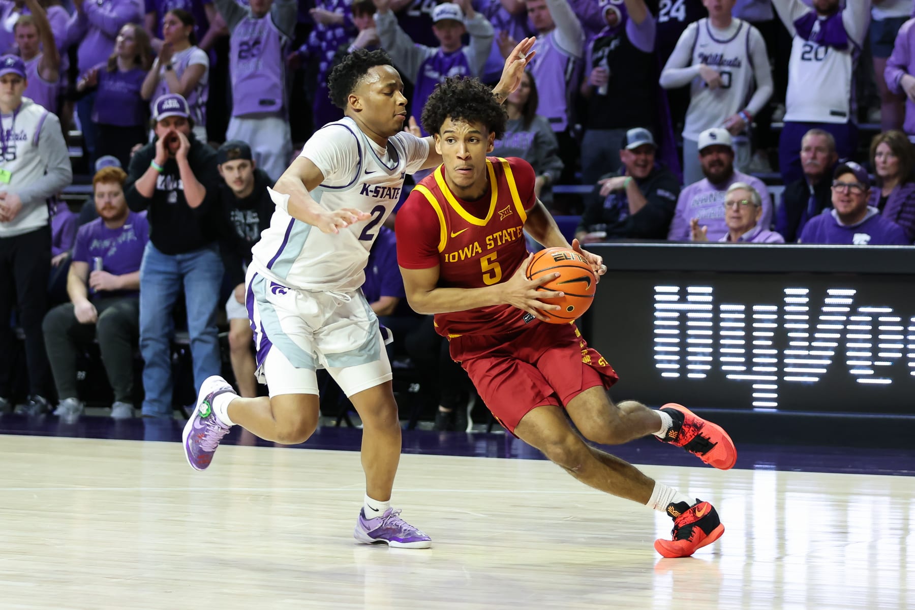MANHATTAN, KS - MARCH 09: Iowa State Cyclones guard Curtis Jones (5) drives past Kansas State Wildcats guard Tylor Perry (2) in the second half of a Big 12 basketball game between the Iowa State Cyclones and Kansas State Wildcats on Mar 9, 2024 at Bramlage Coliseum in Manhattan, KS. (Photo by Scott Winters/Icon Sportswire via Getty Images)