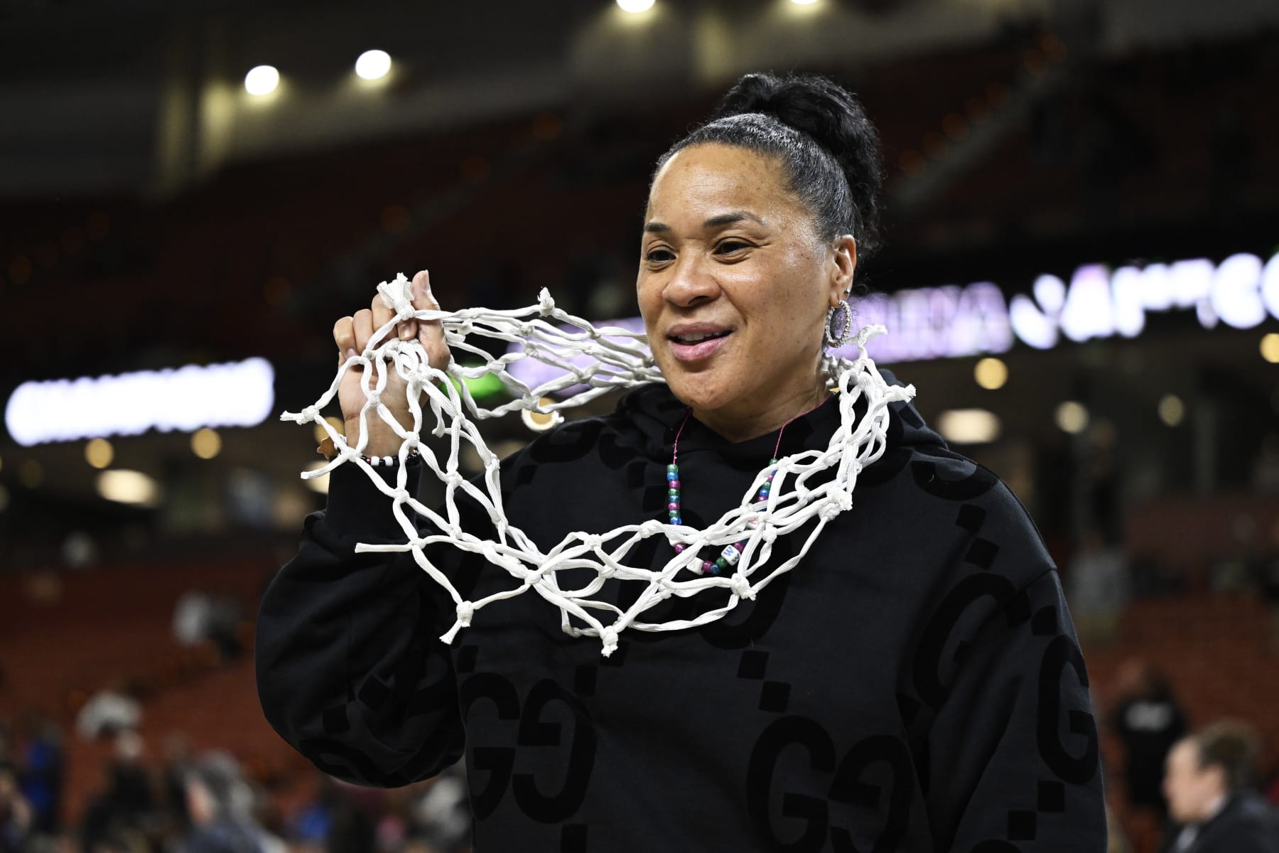 GREENVILLE, SOUTH CAROLINA - MARCH 10: Head coach Dawn Staley of the South Carolina Gamecocks wears the net after their win over the LSU Lady Tigers following the championship game of the SEC Women's Basketball Tournament at Bon Secours Wellness Arena on March 10, 2024 in Greenville, South Carolina. (Photo by Eakin Howard/Getty Images)