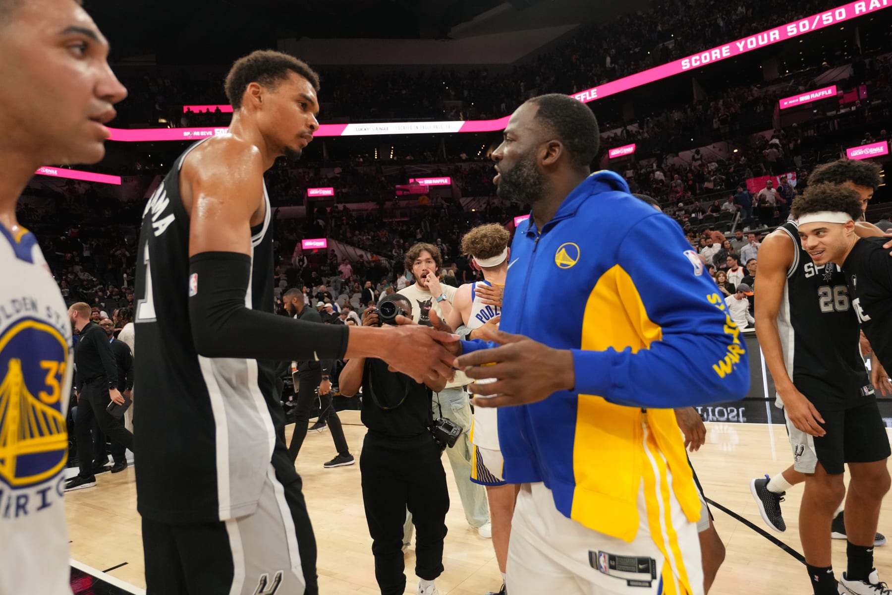 SAN ANTONIO, TX - MARCH 11: Victor Wembanyama #1 of the San Antonio Spurs and Draymond Green #23 of the Golden State Warriors shake hands after the game on March 11, 2024 at the AT&T Center in San Antonio, Texas. NOTE TO USER: User expressly acknowledges and agrees that, by downloading and or using this photograph, user is consenting to the terms and conditions of the Getty Images License Agreement. Mandatory Copyright Notice: Copyright 2024 NBAE (Photos by Jesse D. Garrabrant/NBAE via Getty Images)
