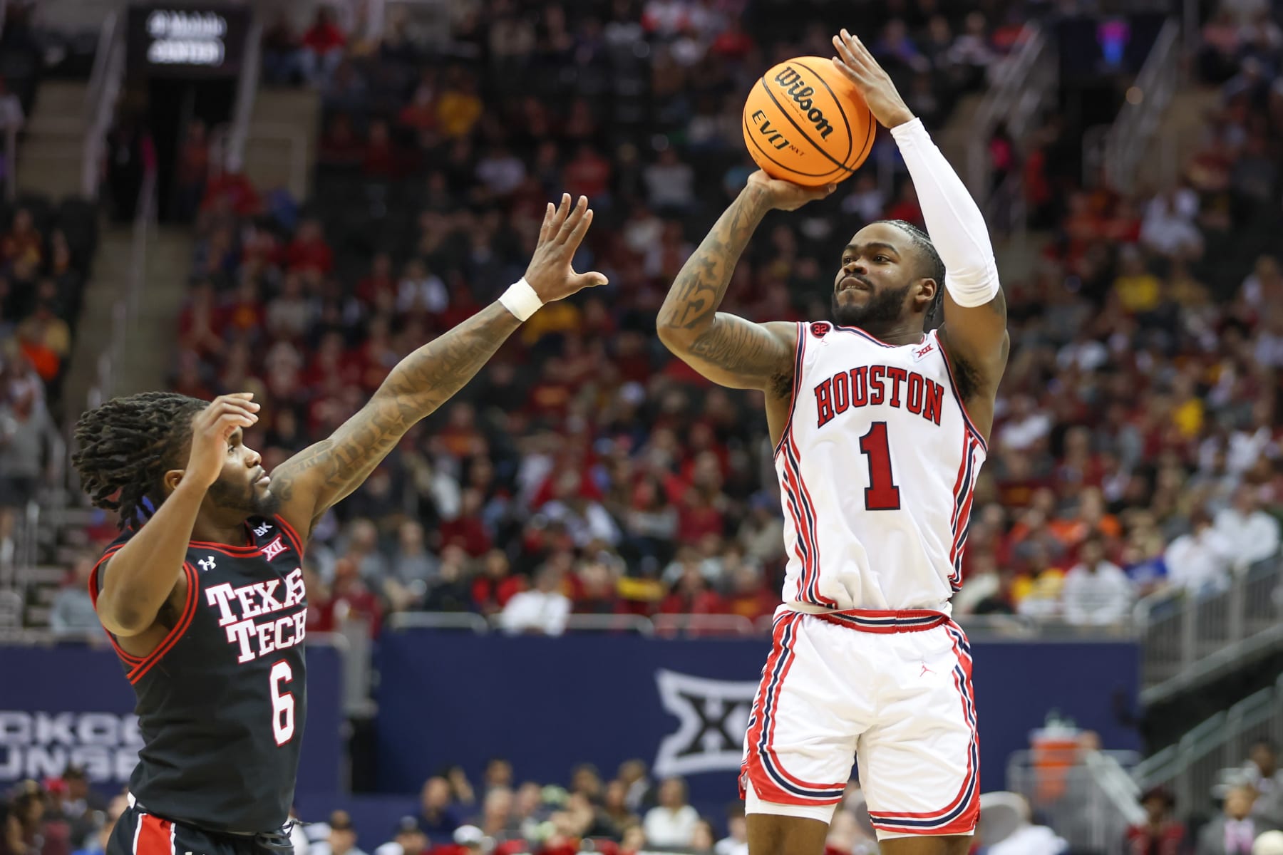 KANSAS CITY, MO - MARCH 15: Houston Cougars guard Jamal Shead (1) shoots a three over Texas Tech Red Raiders guard Joe Toussaint (6) in the second half of a Big 12 tournament semifinal game between the Texas Tech Red Raiders and Houston Cougars on Mar 15, 2024 at T-Mobile Center in Kansas City, MO. (Photo by Scott Winters/Icon Sportswire via Getty Images)