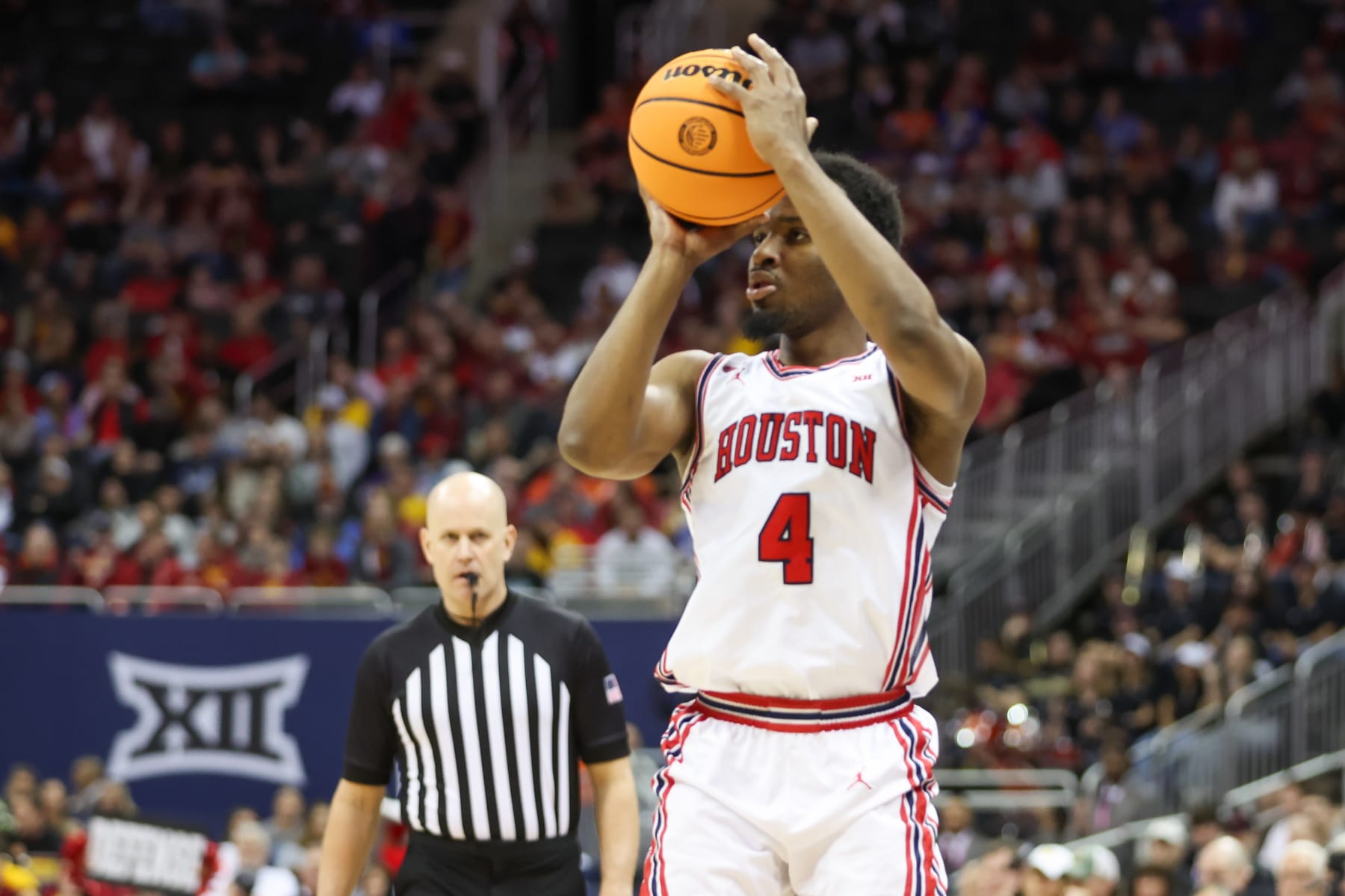KANSAS CITY, MO - MARCH 15: Houston Cougars guard L.J. Cryer (4) shoots a three in the second half of a Big 12 tournament semifinal game between the Texas Tech Red Raiders and Houston Cougars on Mar 15, 2024 at T-Mobile Center in Kansas City, MO. (Photo by Scott Winters/Icon Sportswire via Getty Images)