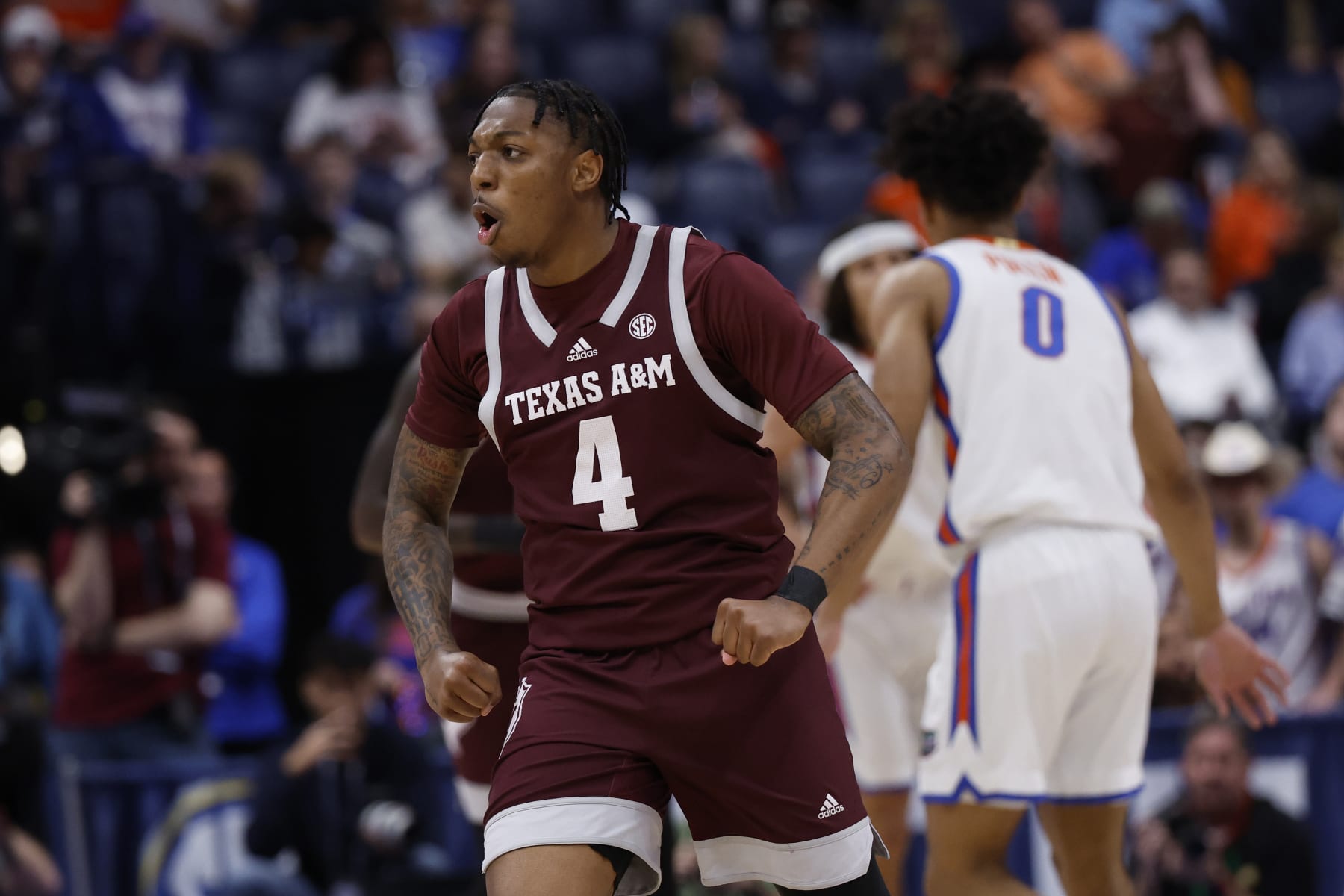 NASHVILLE, TN - MARCH 16: Texas A&M Aggies guard Wade Taylor IV (4) flexes after hitting a 3-pointer during a semifinal round game of the men's Southeastern Conference Tournament between the Florida Gators and Texas A&M Aggies March 16, 2024, at Bridgestone Arena in Nashville, Tennessee.