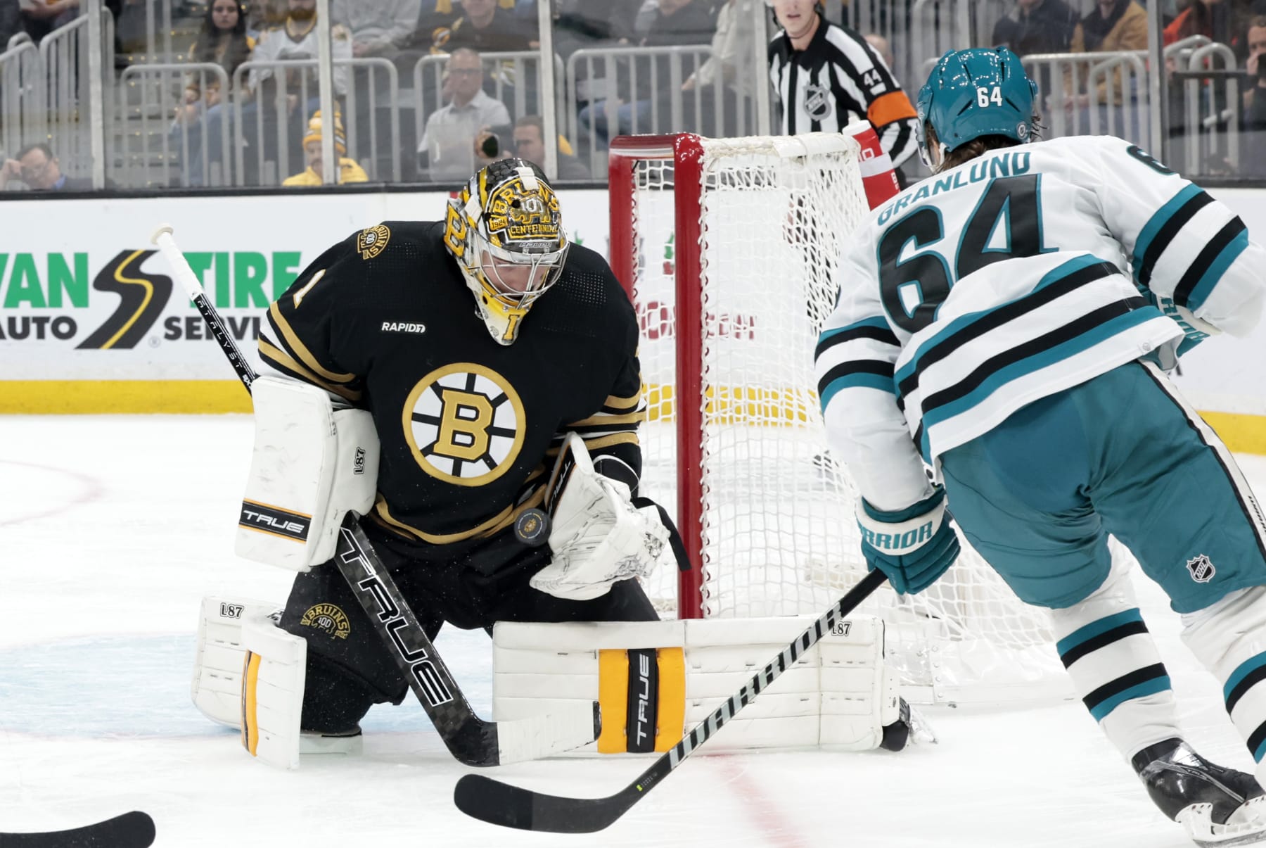 BOSTON, MA - NOVEMBER 30: Boston Bruins goalie Jeremy Swayman (1) gloves the shot from San Jose Sharks center Mikael Granlund (64) during a game between the Boston Bruins and the San Jose Sharks on November 30, 2023, at TD garden in Boston, Massachusetts. (Photo by Fred Kfoury III/Icon Sportswire via Getty Images)