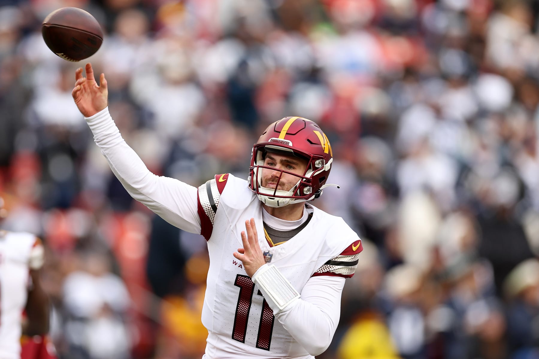 LANDOVER, MARYLAND - JANUARY 07: Sam Howell #14 of the Washington Commanders warms up before the game against the Dallas Cowboys at FedExField on January 07, 2024 in Landover, Maryland. (Photo by Scott Taetsch/Getty Images)