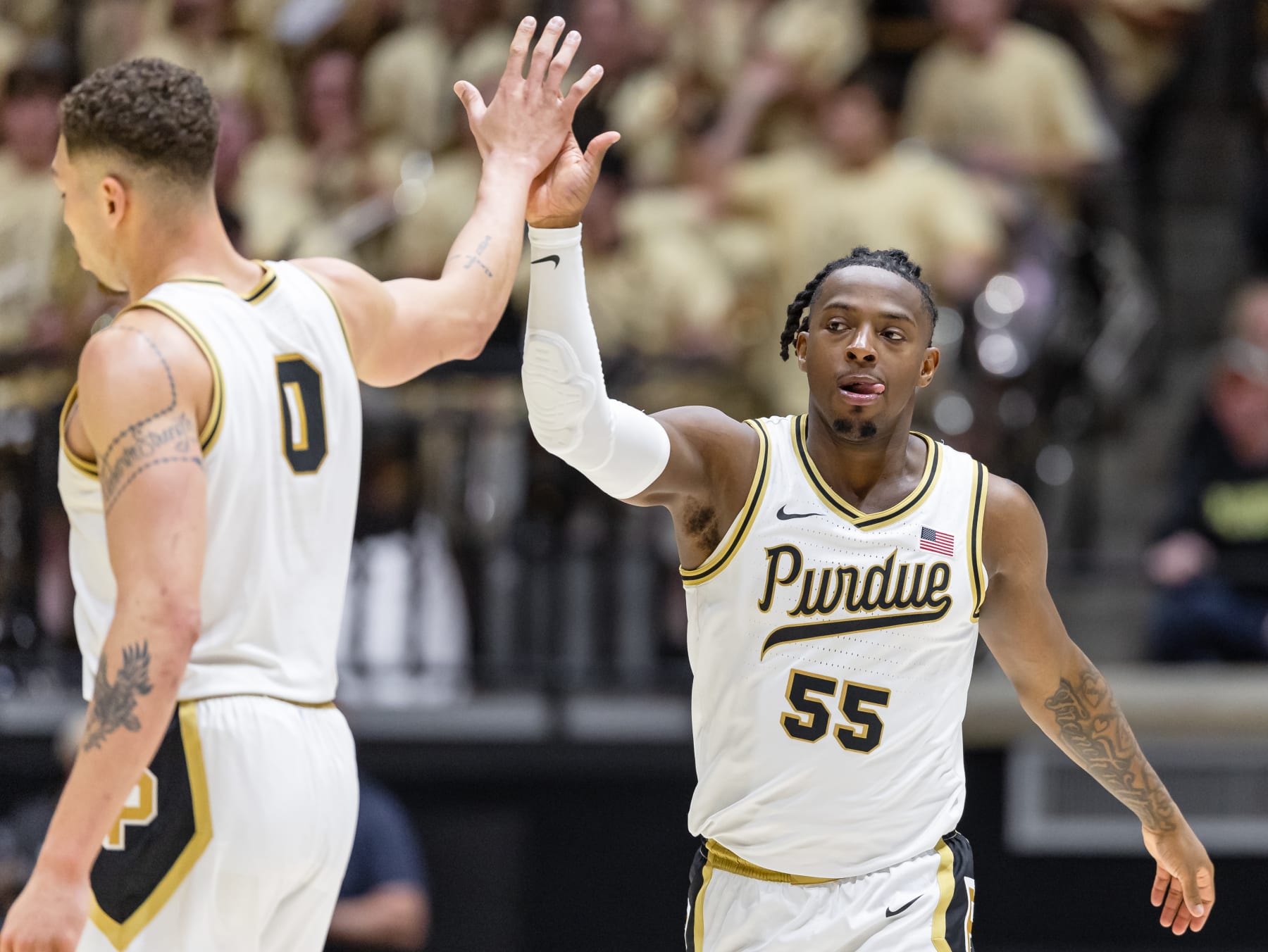 WEST LAFAYETTE, INDIANA - MARCH 10: Mason Gillis #0 and Lance Jones #55 of the Purdue Boilermakers high five during the game against the Wisconsin Badgers at Mackey Arena on March 10, 2024 in West Lafayette, Indiana. (Photo by Michael Hickey/Getty Images)