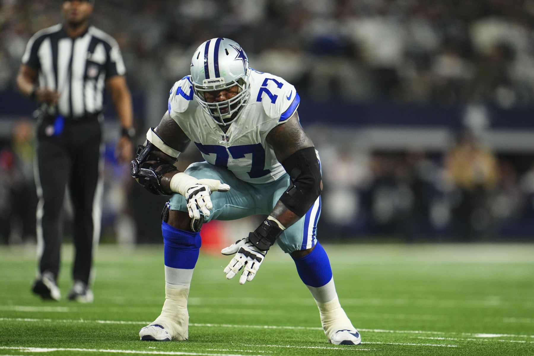 DALLAS, TX - JANUARY 14: Tyron Smith #77 of the Dallas Cowboys lines up during an NFL wild-card playoff football game against the Green Bay Packers at AT&T Stadium on January 14, 2024 in Dallas, Texas. (Photo by Cooper Neill/Getty Images)