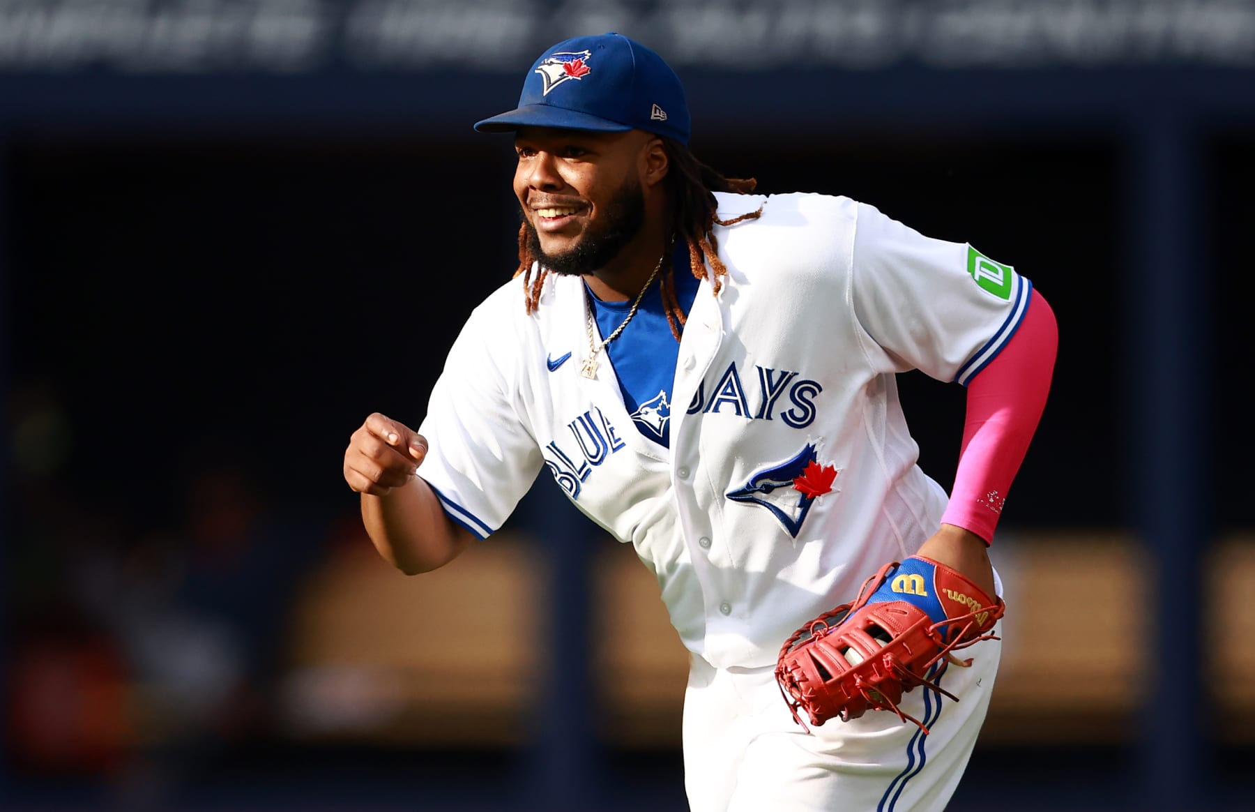 TORONTO, ON - SEPTEMBER 16:  Vladimir Guerrero Jr. #27 of the Toronto Blue Jays reacts after catching Justin Turner #2 of the Boston Red Sox out in the seventh inning at Rogers Centre on September 16, 2023 in Toronto, Ontario, Canada.  (Photo by Vaughn Ridley/Getty Images)