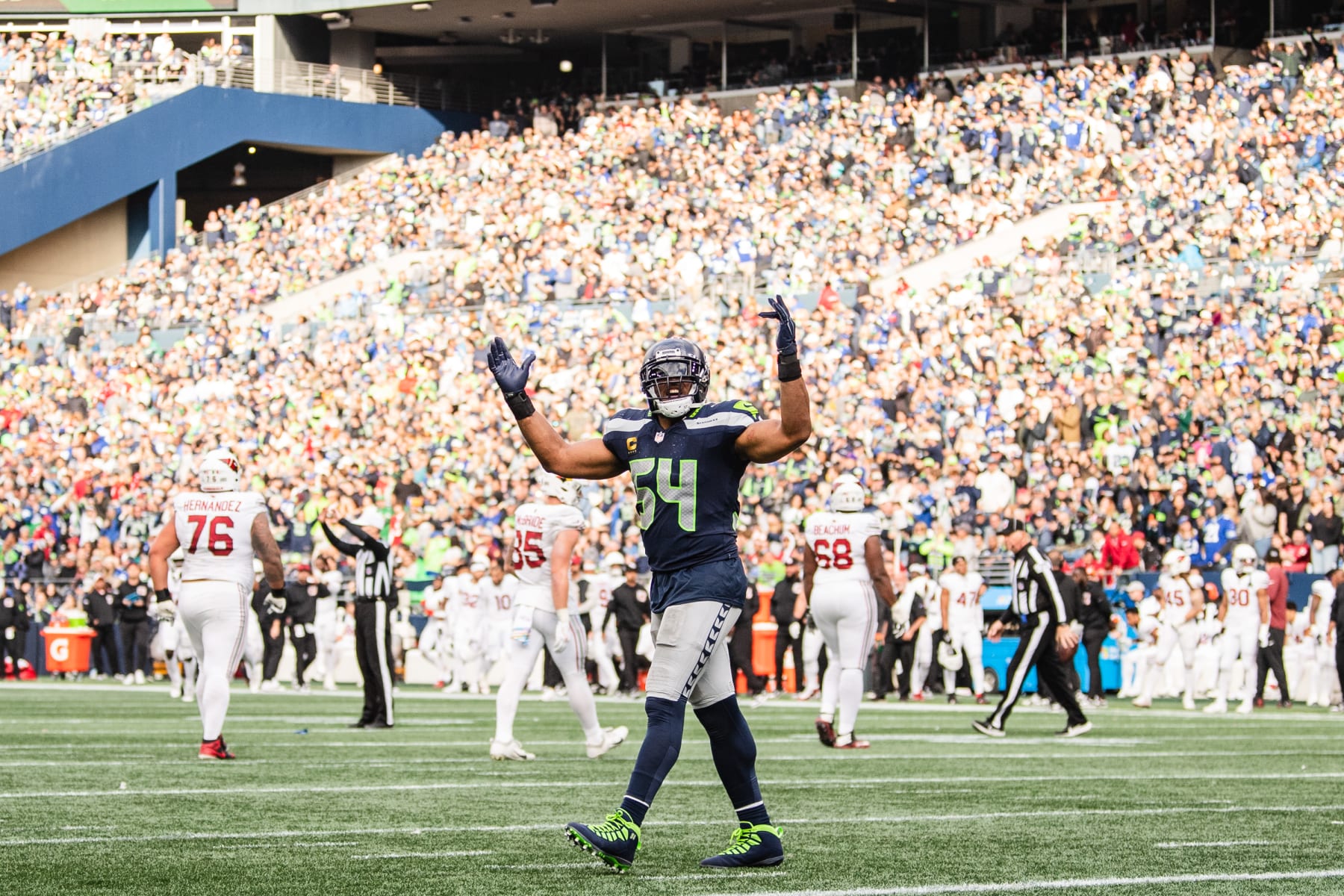 SEATTLE, WASHINGTON - OCTOBER 22: Bobby Wagner #54 of the Seattle Seahawks pumps up the crowd during the third quarter of the game against the Arizona Cardinals at Lumen Field on October 22, 2023 in Seattle, Washington. (Photo by Jane Gershovich/Getty Images)