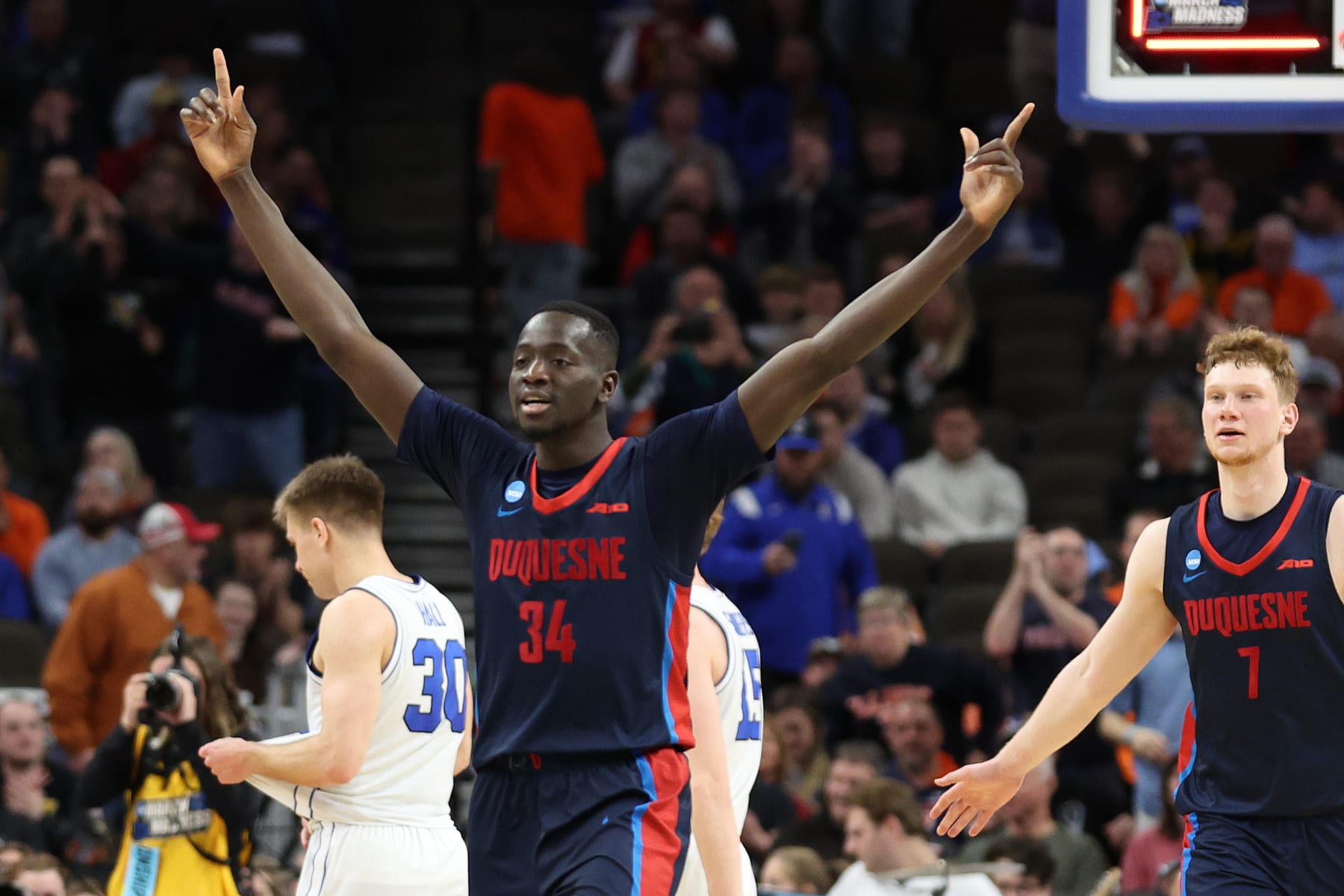OMAHA, NEBRASKA - MARCH 21: Fousseyni Drame #34 of the Duquesne Dukes reacts after defeating the Brigham Young Cougars during the second half in the first round of the NCAA Men's Basketball Tournament at CHI Health Center on March 21, 2024 in Omaha, Nebraska. (Photo by Jamie Squire/Getty Images)