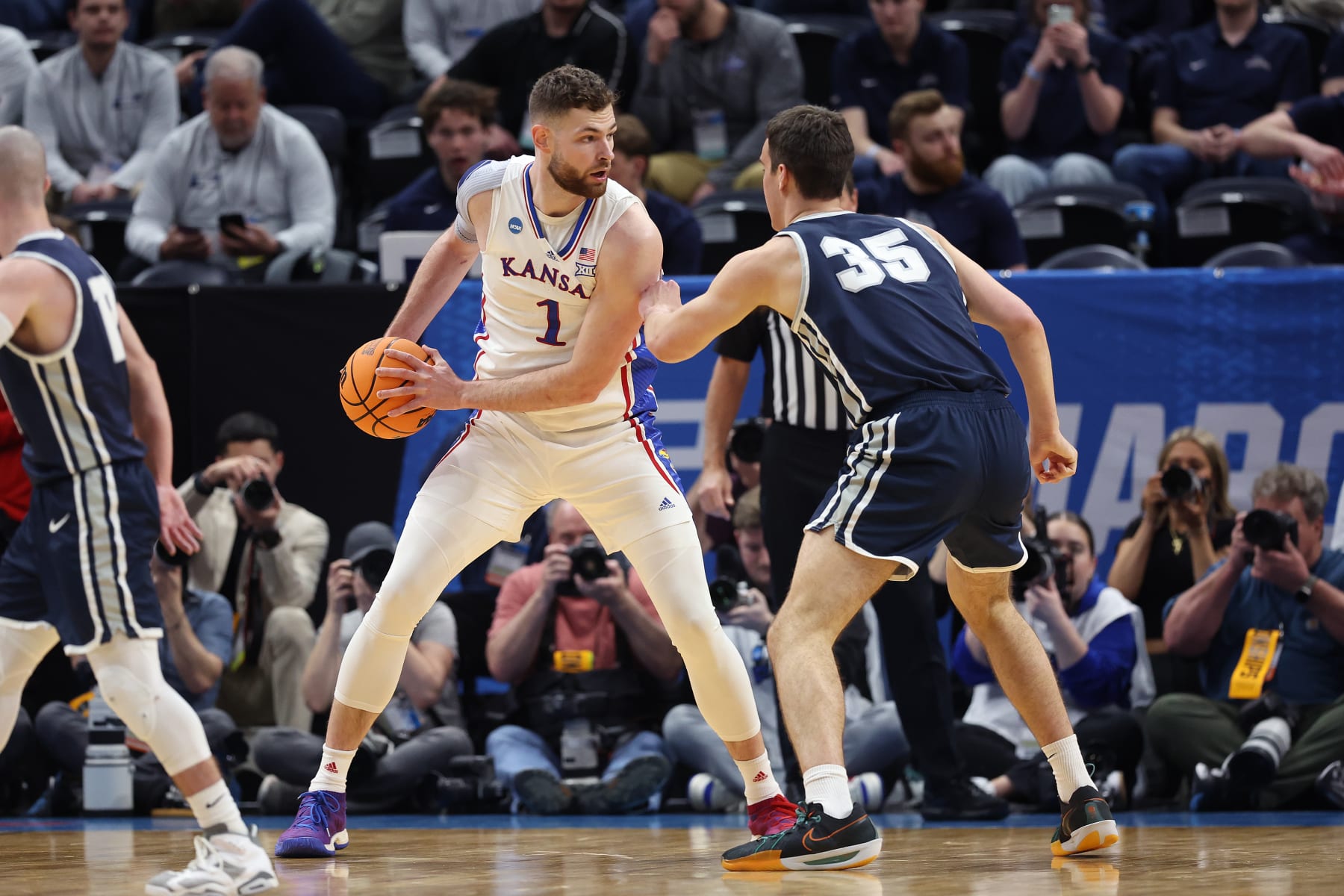 SALT LAKE CITY, UTAH - MARCH 21:  Hunter Dickinson #1 of the Kansas Jayhawks is defended by Riley Allenspach #35 of the Samford Bulldogs during the first half in the first round of the NCAA Men's Basketball Tournament at Delta Center on March 21, 2024 in Salt Lake City, Utah. (Photo by Christian Petersen/Getty Images)