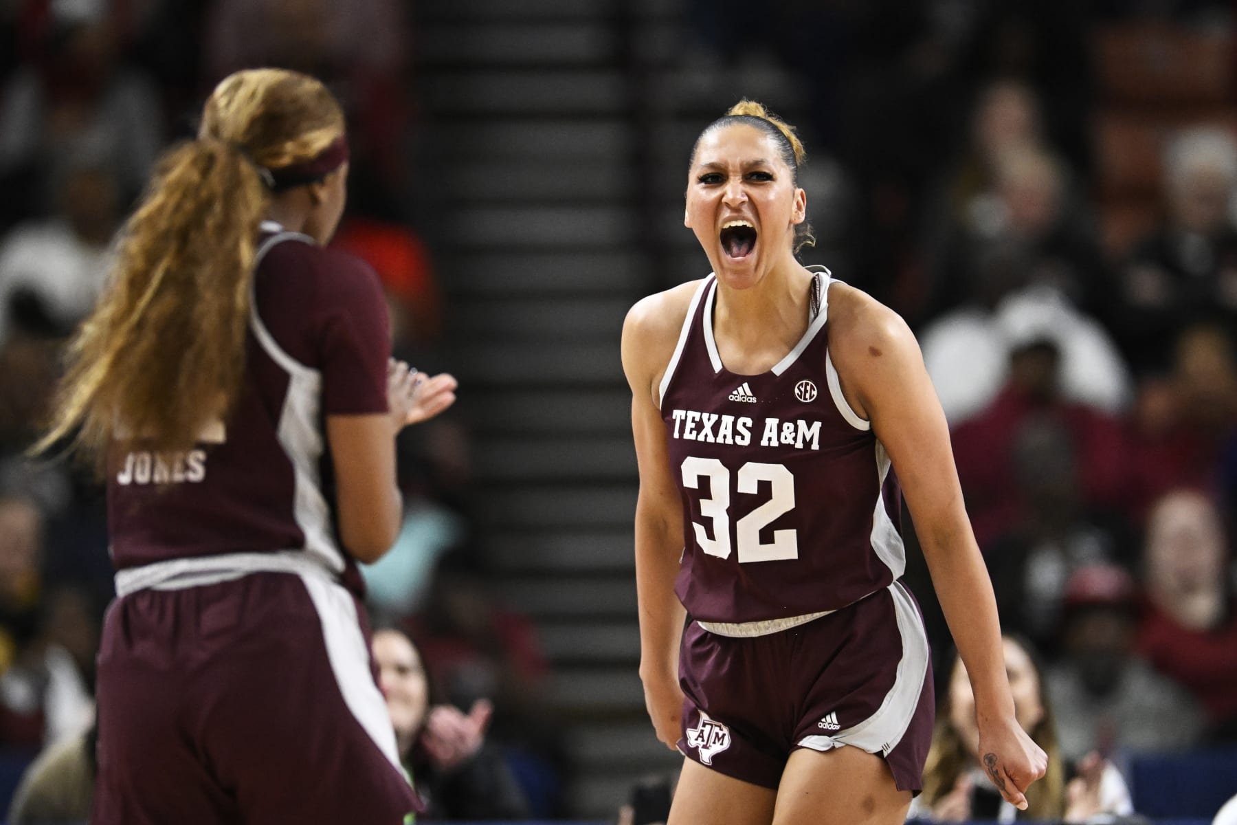 GREENVILLE, SOUTH CAROLINA - MARCH 08: Lauren Ware #32 of the Texas A&M Aggies celebrates her basket and foul against the South Carolina Gamecocks in the third quarter during the quarterfinals of the SEC Women's Basketball Tournament at Bon Secours Wellness Arena on March 08, 2024 in Greenville, South Carolina. (Photo by Eakin Howard/Getty Images)