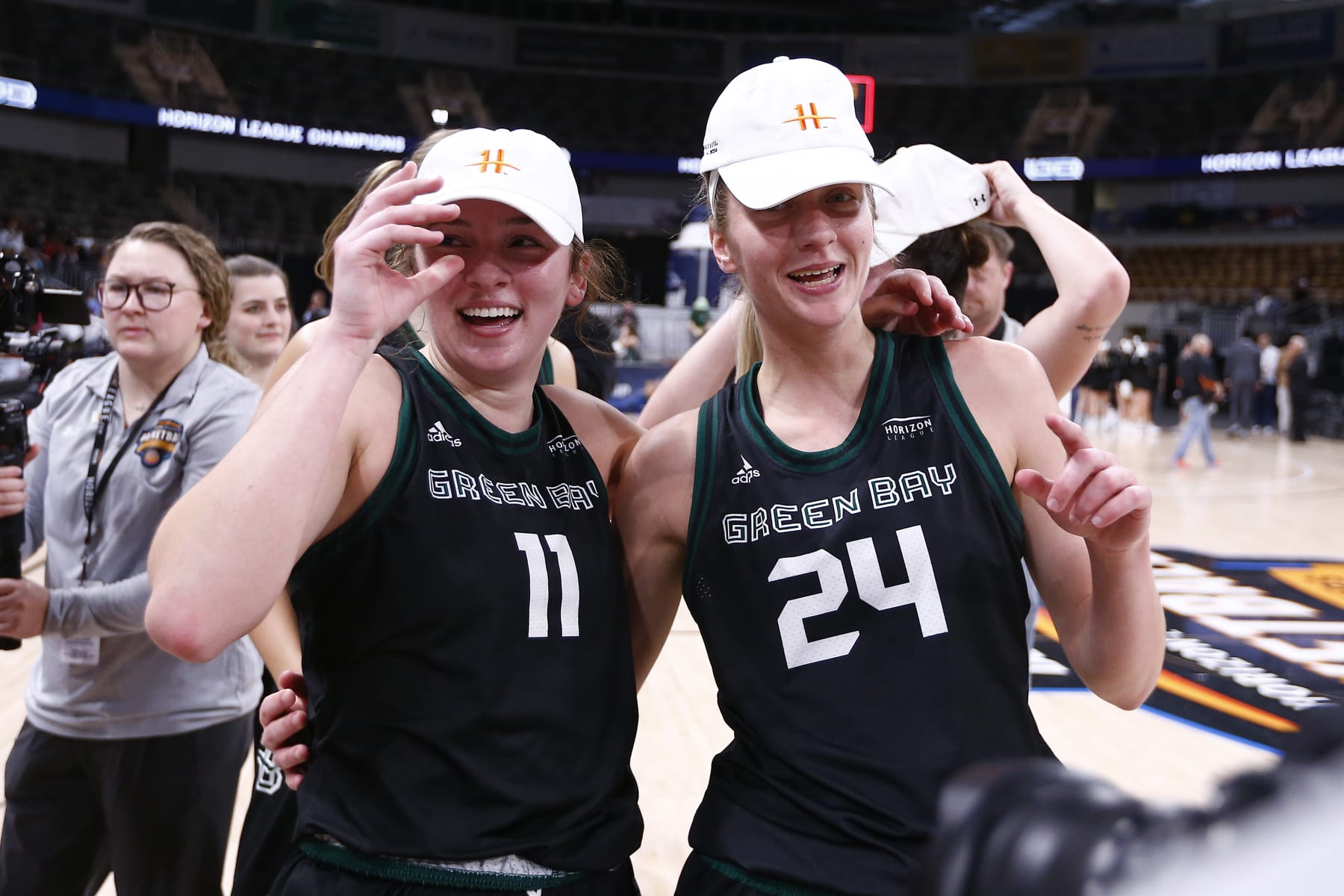 INDIANAPOLIS, IN - MARCH 12: Green Bay Phoenix guard Natalie McNeal (11) and Green Bay Phoenix guard Natalie Andersen (24) celebrate winning the Horizon League Women's Championship game between the Cleveland State Vikings and the Green Bay Phoenix on March 12, 2024 at the Indiana Farmers Coliseum in Indianapolis, IN.(Photo by Jeffrey Brown/Icon Sportswire via Getty Images)
