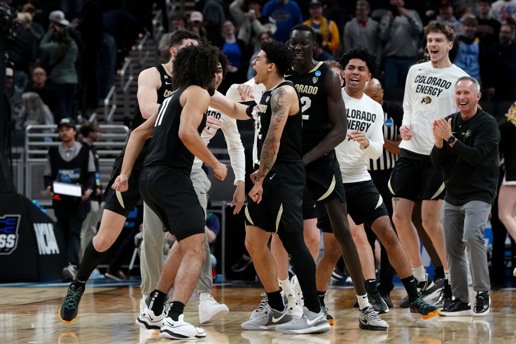 INDIANAPOLIS, INDIANA - MARCH 22: KJ Simpson #2 of the Colorado Buffaloes celebrates with his teammates after hitting the game winning shot to defeat the Florida Gators in the first round of the NCAA Men's Basketball Tournament at Gainbridge Fieldhouse on March 22, 2024 in Indianapolis, Indiana. (Photo by Dylan Buell/Getty Images)