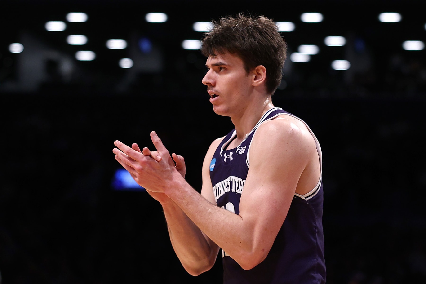 NEW YORK, NEW YORK - MARCH 22: Brooks Barnhizer #13 of the Northwestern Wildcats reacts in the first half against the Florida Atlantic Owls in the first round of the NCAA Men's Basketball Tournament at Barclays Center on March 22, 2024 in New York City. (Photo by Elsa/Getty Images)