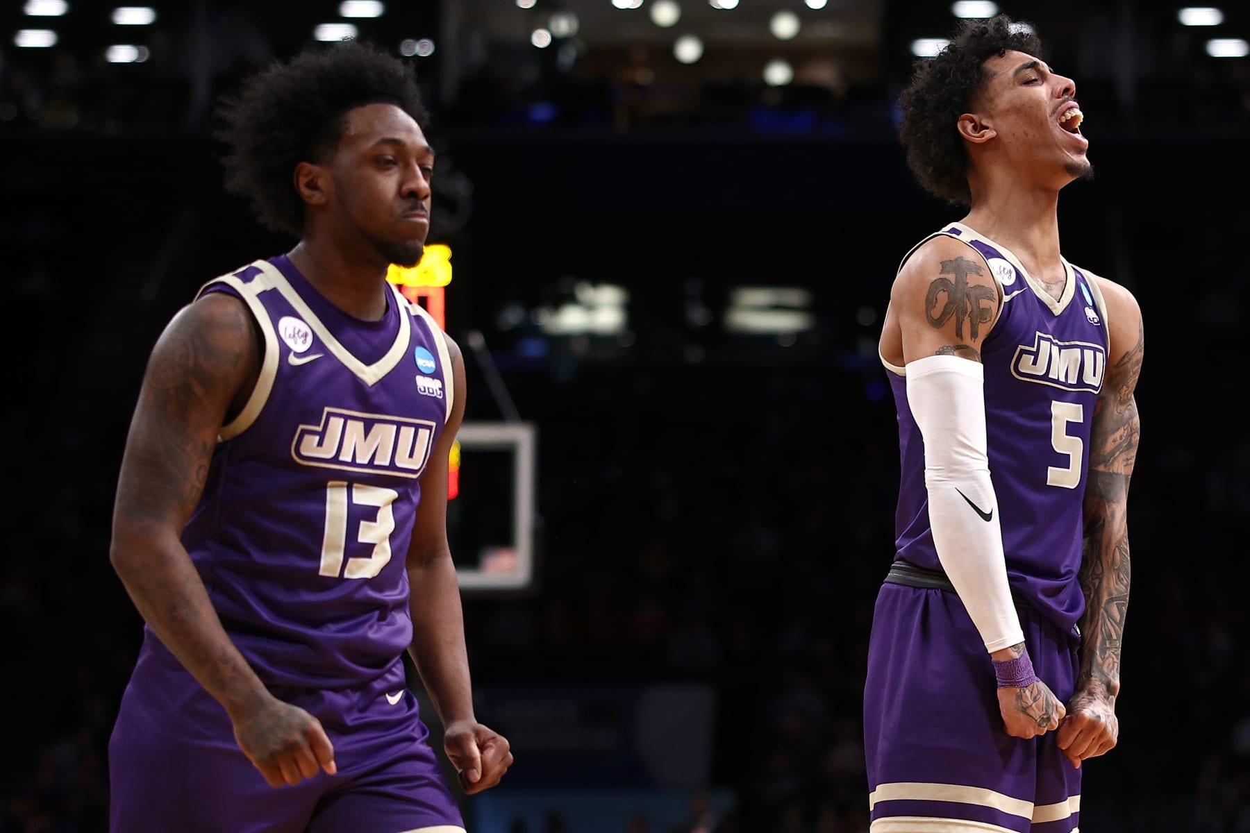 NEW YORK, NEW YORK - MARCH 22: Terrence Edwards Jr. #5 and Michael Green III #13 of the James Madison Dukes react during the first half against the Wisconsin Badgers in the first round of the NCAA Men's Basketball Tournament at Barclays Center on March 22, 2024 in New York City. (Photo by Elsa/Getty Images)
