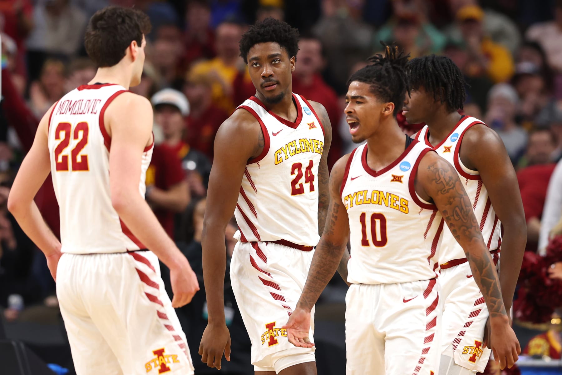 OMAHA, NEBRASKA - MARCH 23: Keshon Gilbert #10 and Hason Ward #24 of the Iowa State Cyclones react with teammates during the second half against the Washington State Cougars in the second round of the NCAA Men's Basketball Tournament at CHI Health Center on March 23, 2024 in Omaha, Nebraska. (Photo by Michael Reaves/Getty Images)