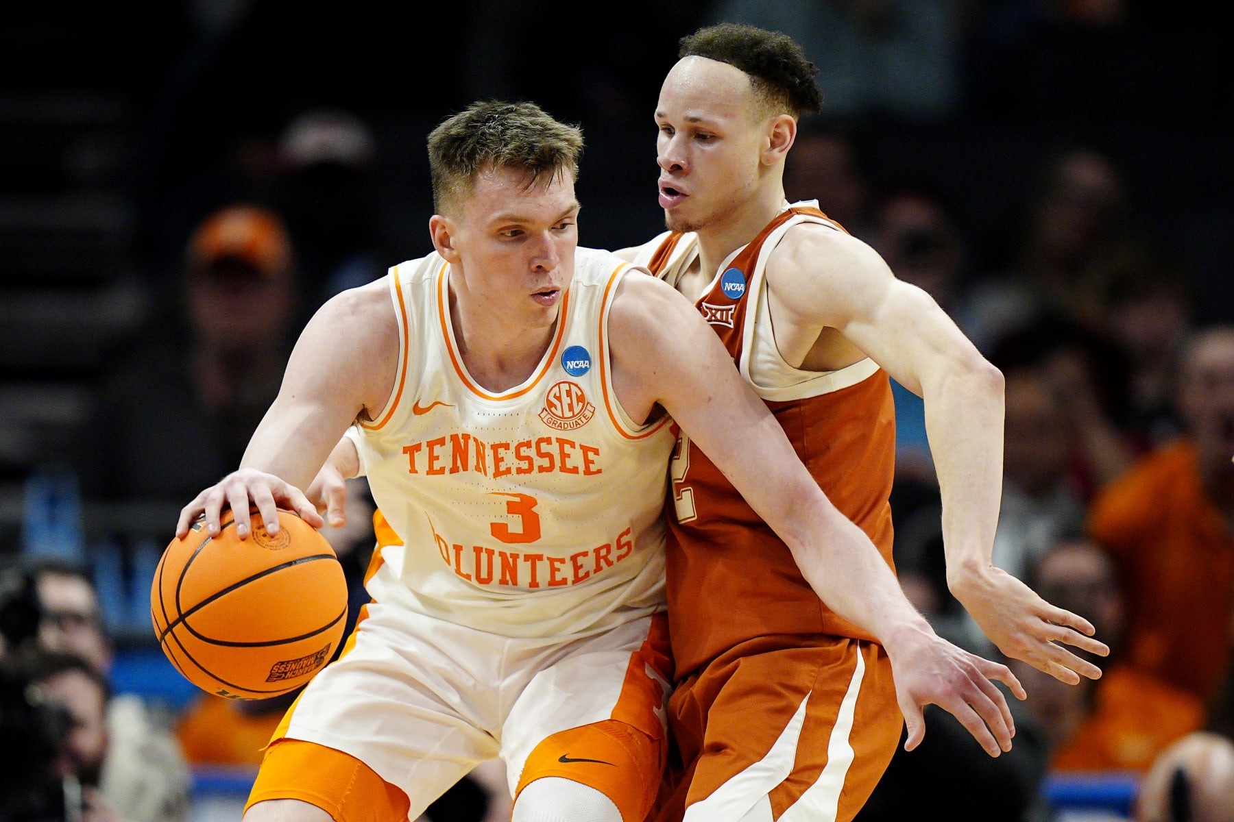 CHARLOTTE, NORTH CAROLINA - MARCH 23: Dalton Knecht #3 of the Tennessee Volunteers fights for position against Chendall Weaver #2 of the Texas Longhorns during the second half in the second round of the NCAA Men's Basketball Tournament at Spectrum Center on March 23, 2024 in Charlotte, North Carolina. (Photo by Jacob Kupferman/Getty Images)